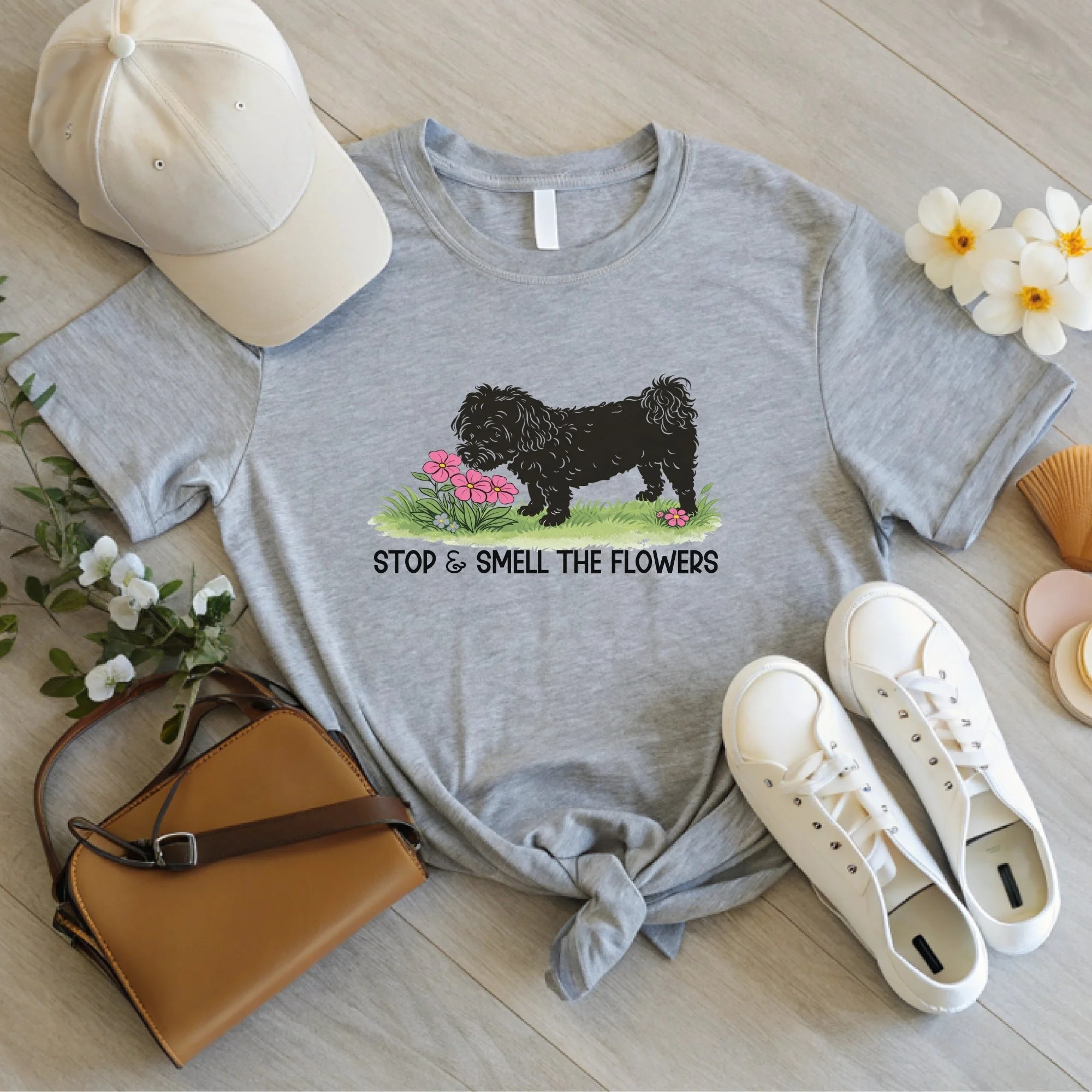 Daytime styled view of Stop and Smell the Flowers graphic shirt on athletic heather gray tee with jeans, sneakers, and spring accessories