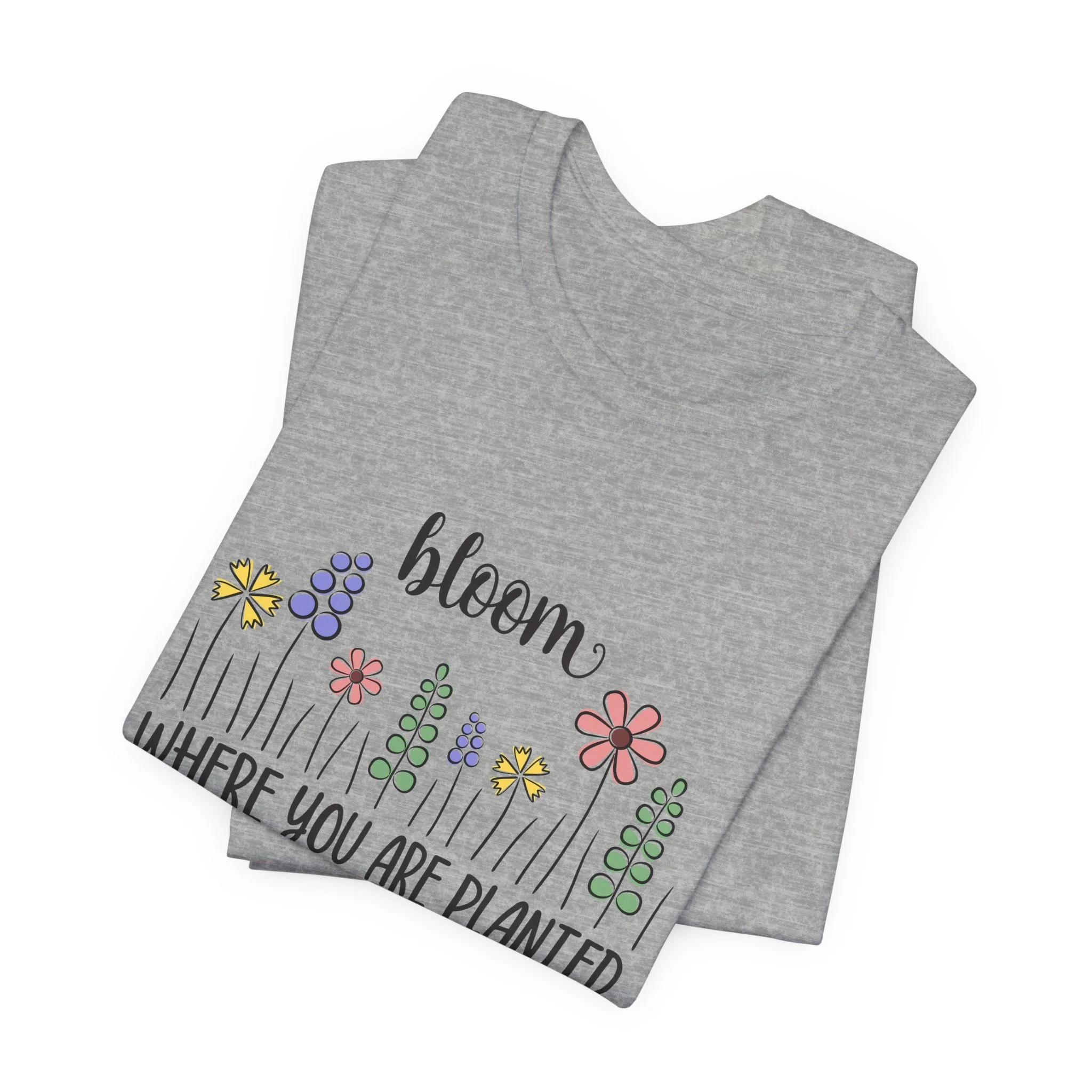 Folded athletic heather gray t-shirt featuring Bloom Where You Are Planted graphic