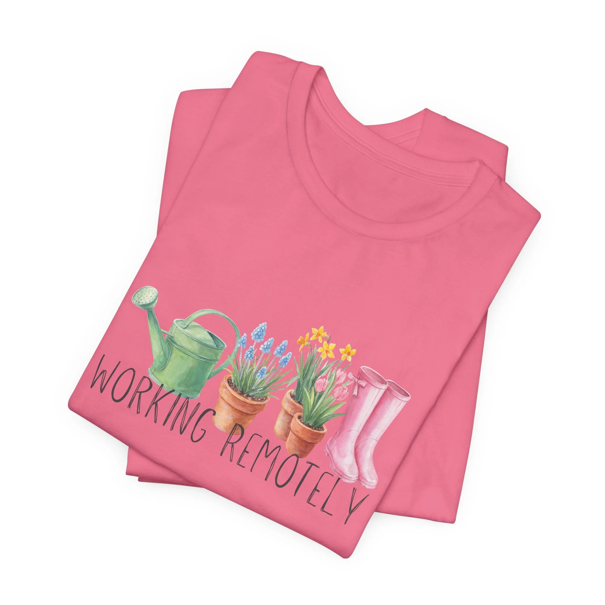 Folded charity pink t-shirt featuring Working Remotely graphic