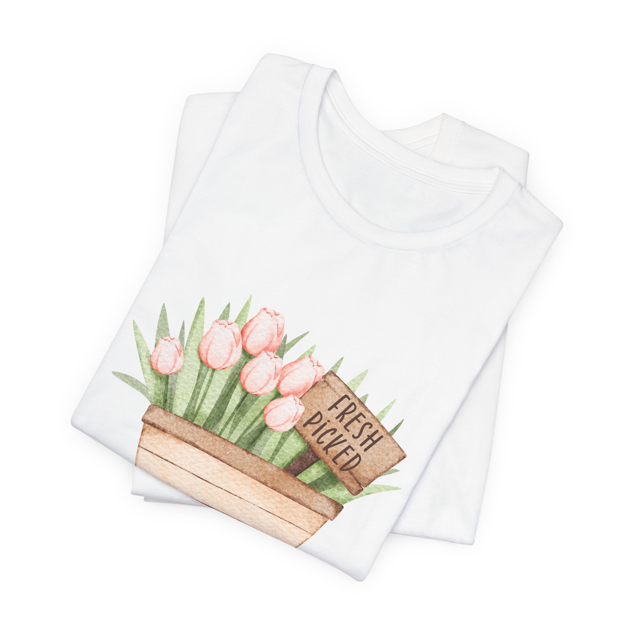 Folded white t-shirt featuring Fresh Picked Tulips wagon graphic