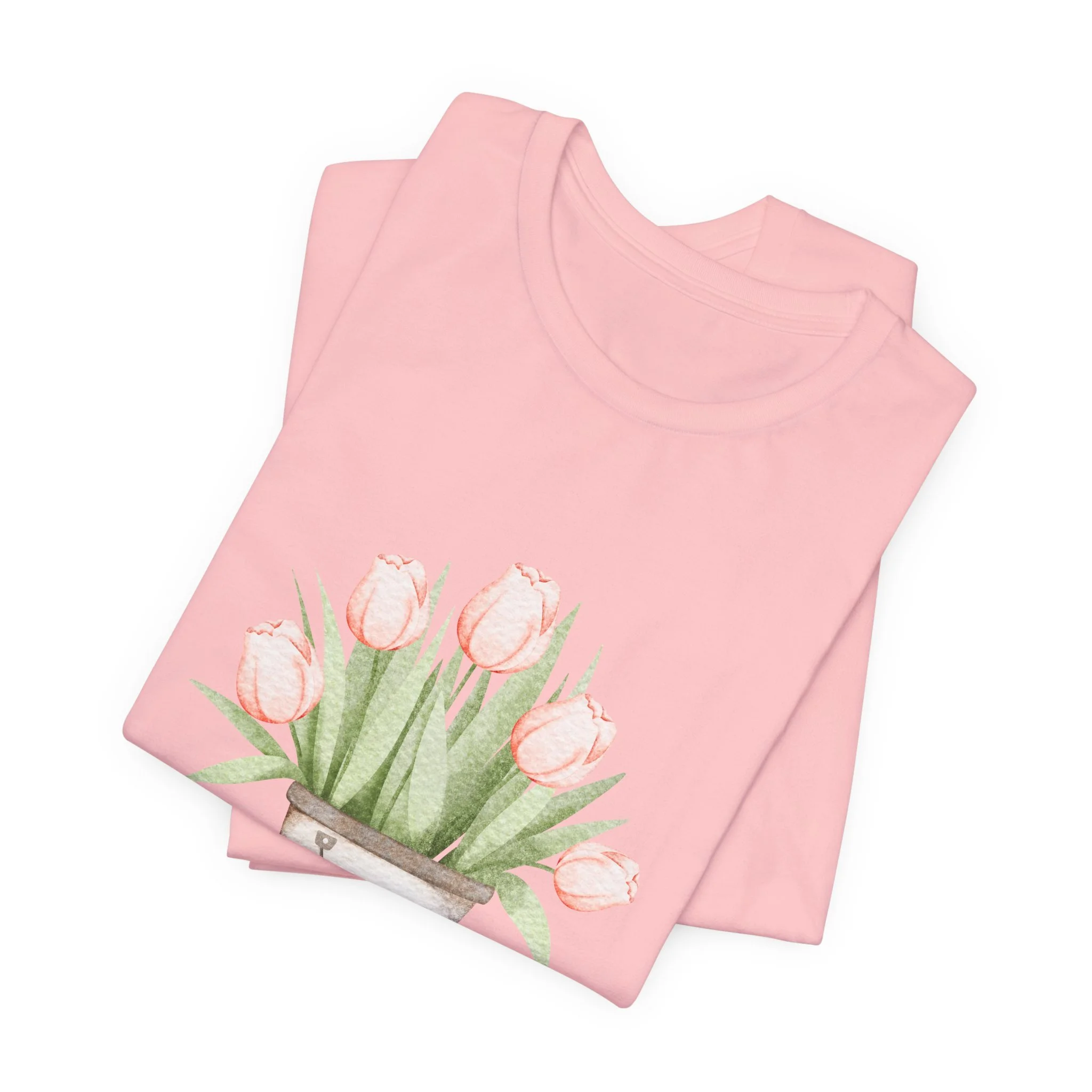 Folded soft pink t-shirt featuring Tulip Bucket graphic
