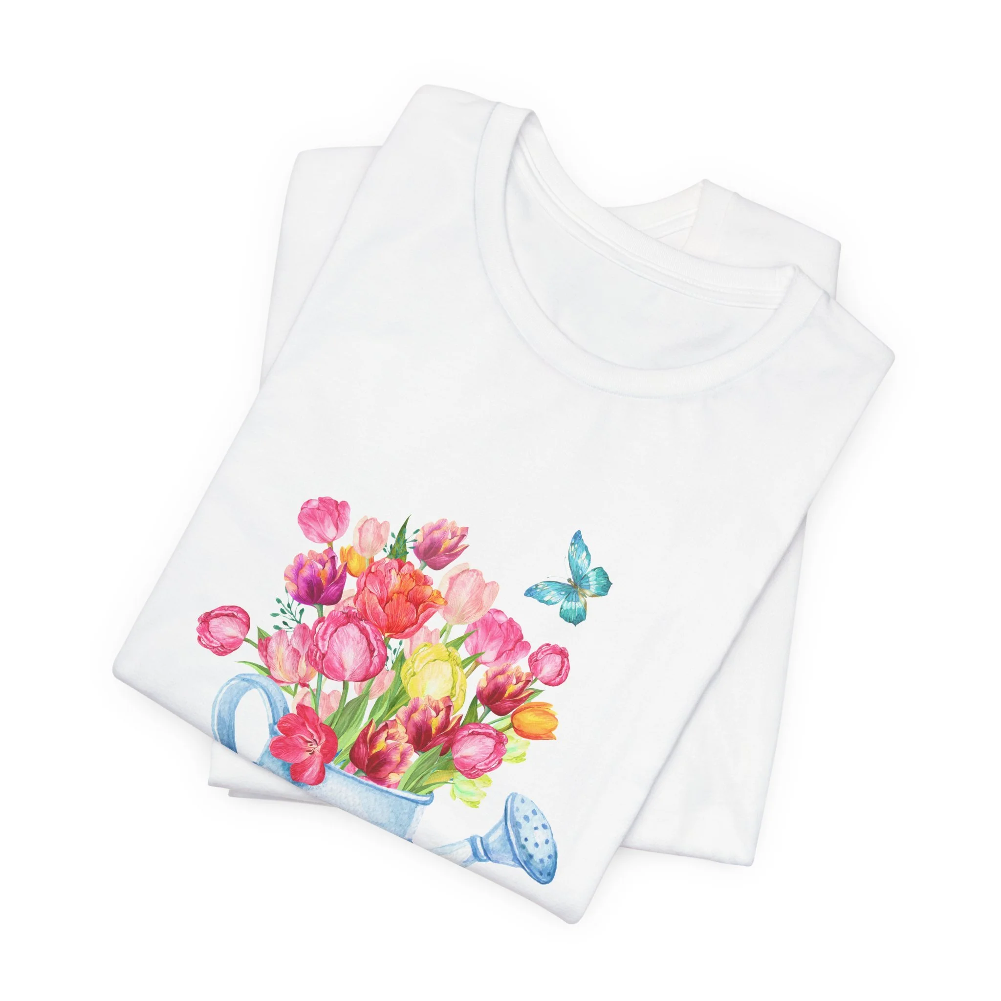 Folded white t-shirt featuring Tulips in Watering Can graphic