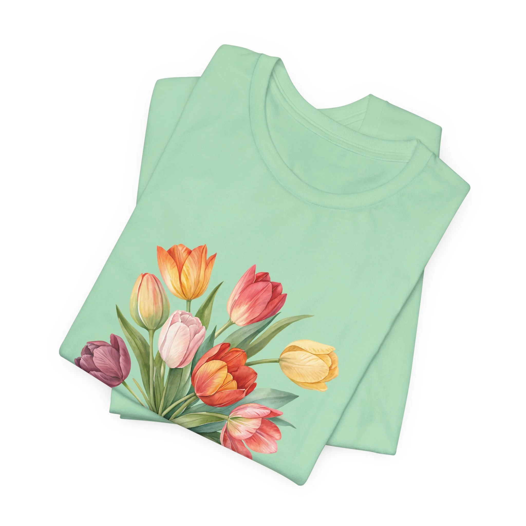 Folded mint green t-shirt featuring Tulip Bouquet graphic