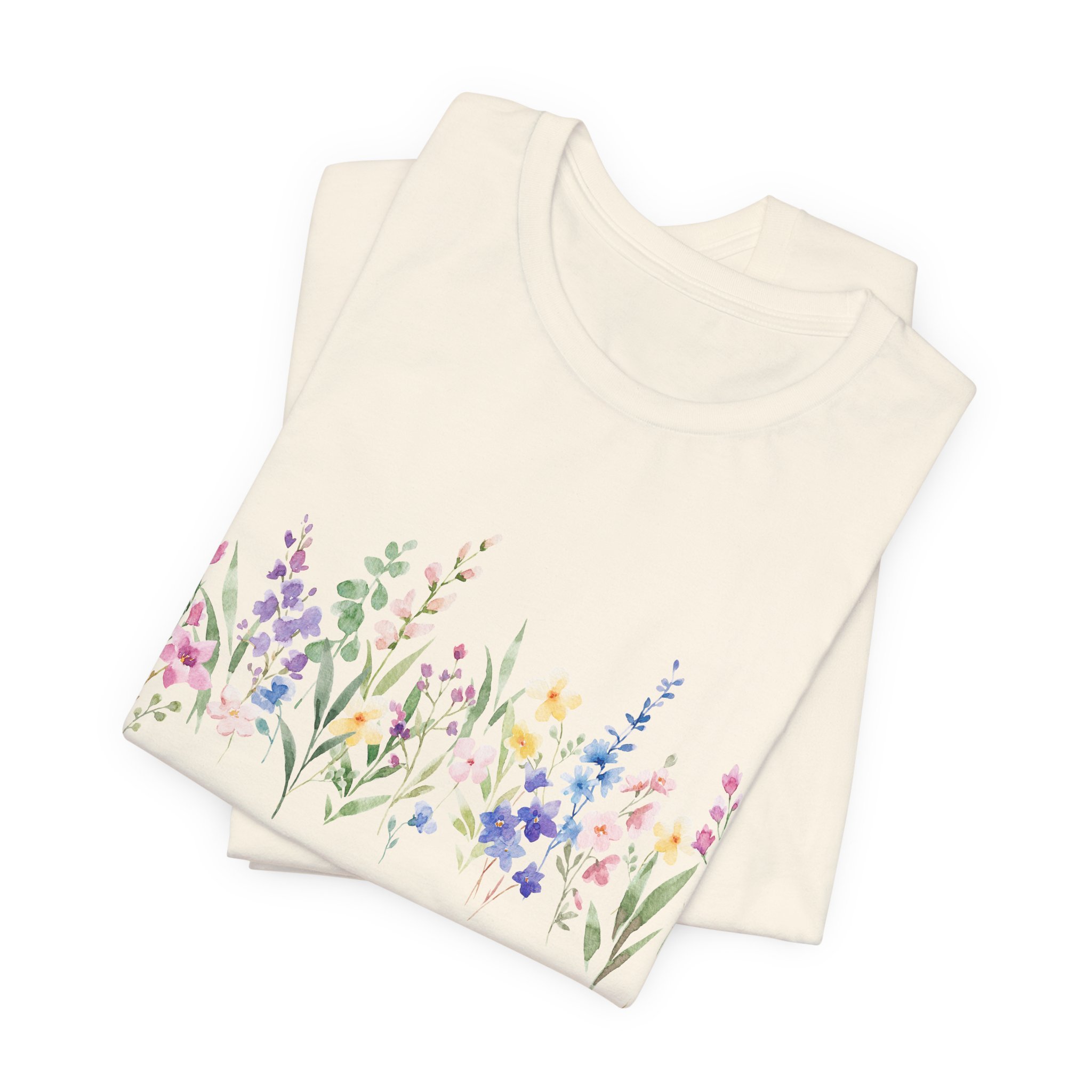 Folded natural cream t-shirt with soft pastel wildflower border design