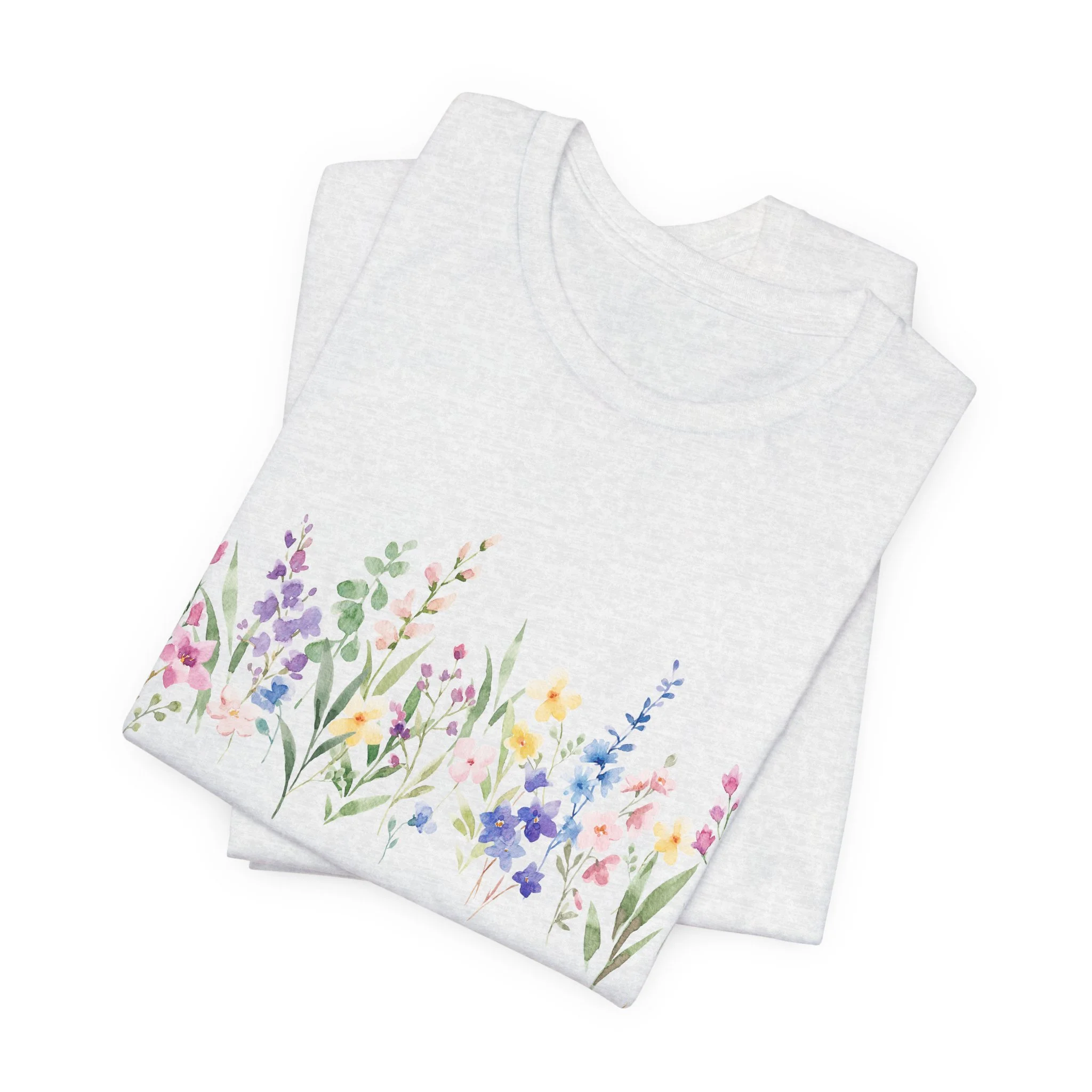 Folded ash gray t-shirt featuring pastel watercolor wildflower border graphic