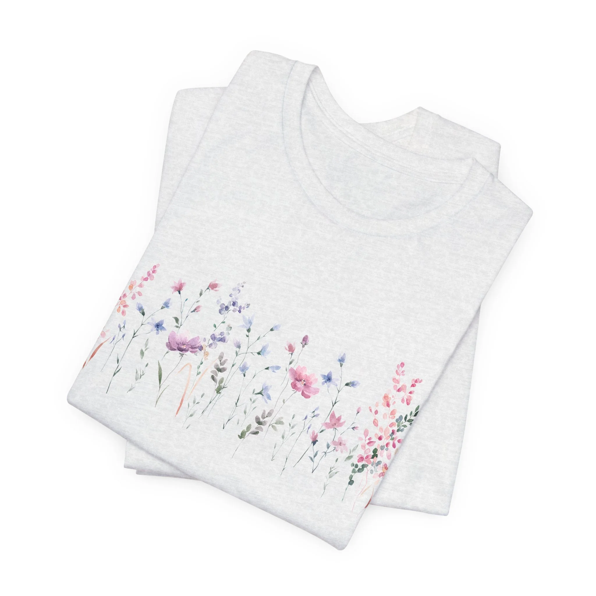 Folded ash gray t-shirt featuring soft watercolor wildflower border design