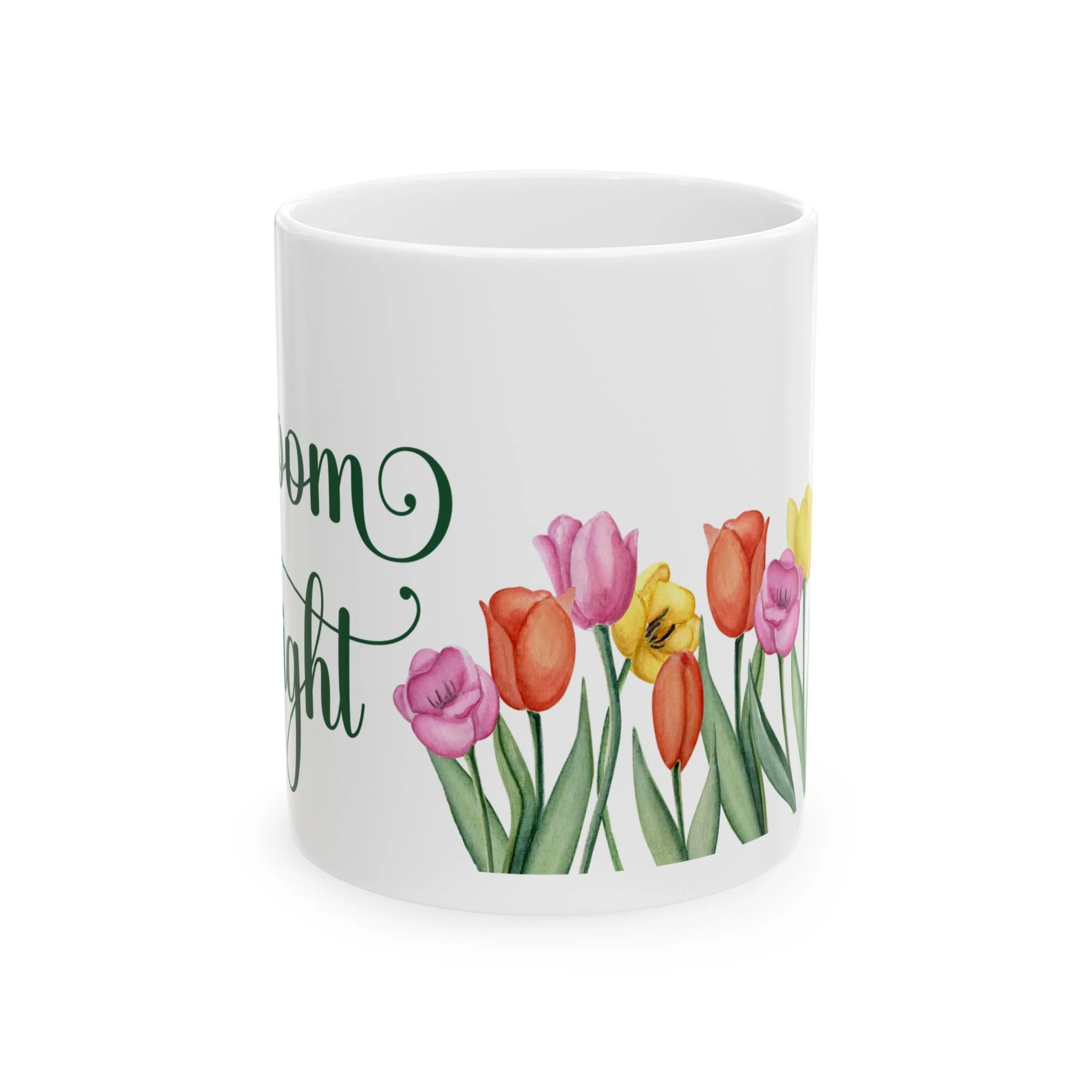 Side view of mug showing colorful tulip flowers wrapping around the base