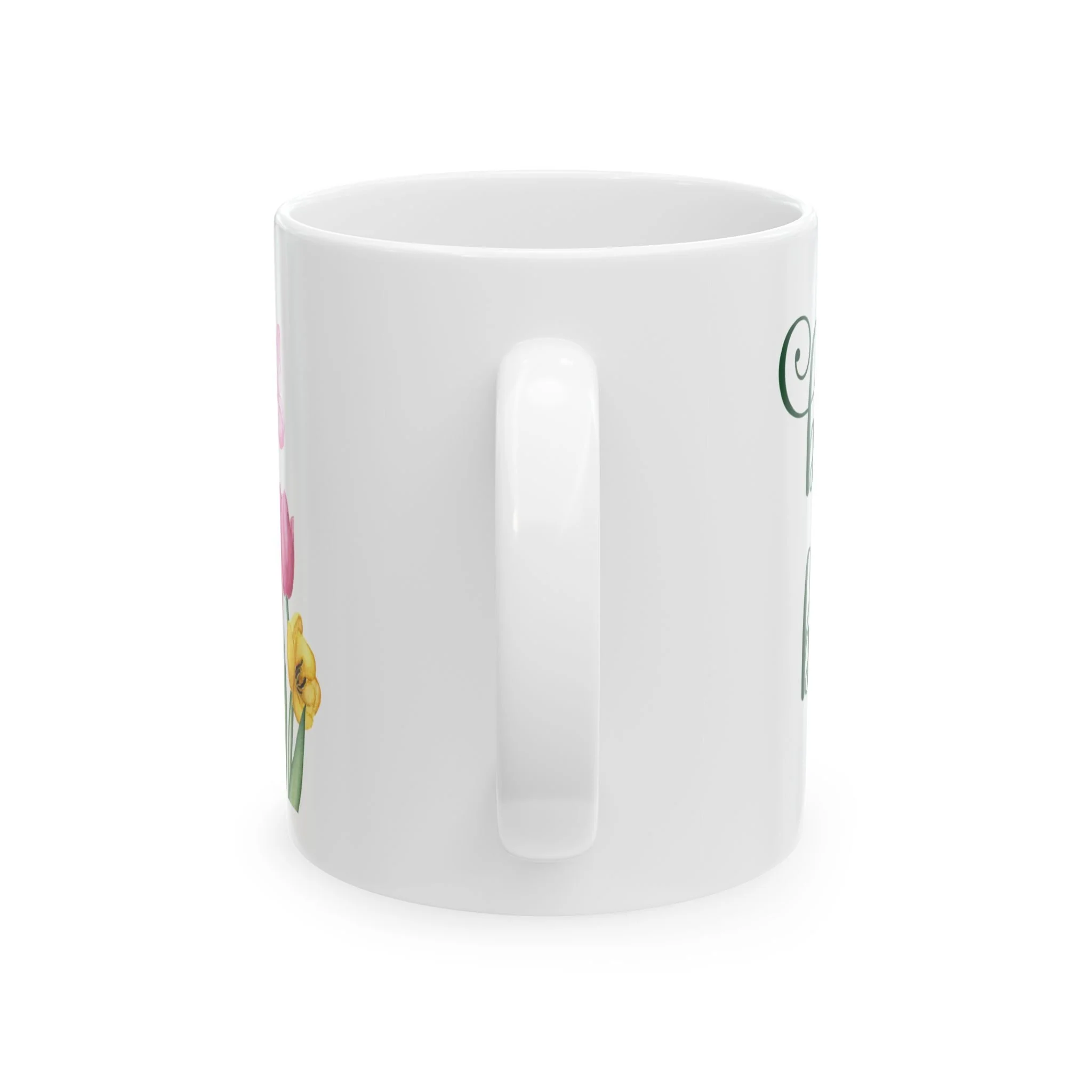 Side profile of mug showing plain white handle and partial floral wrap