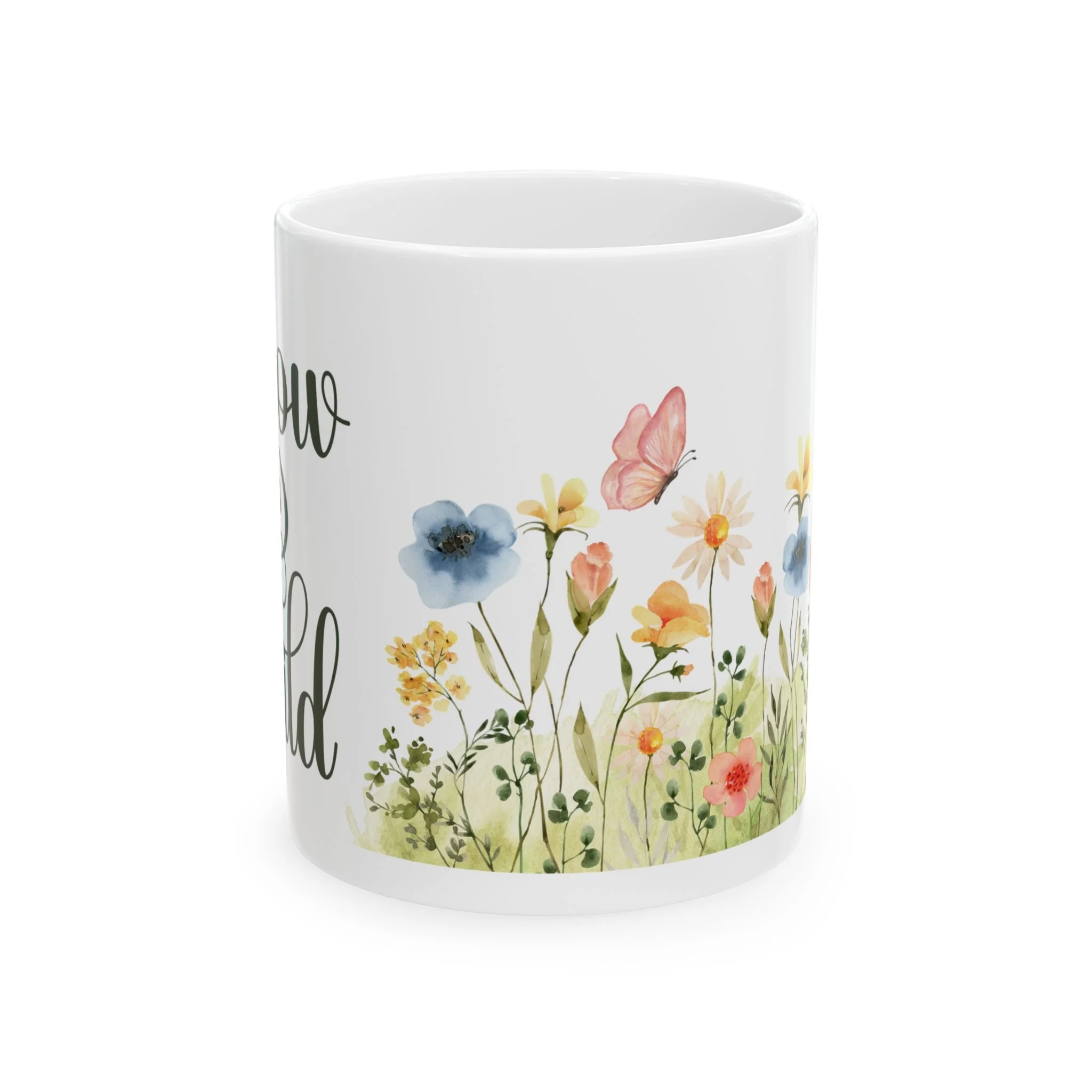 Side view of mug showing colorful wildflower meadow with butterflies