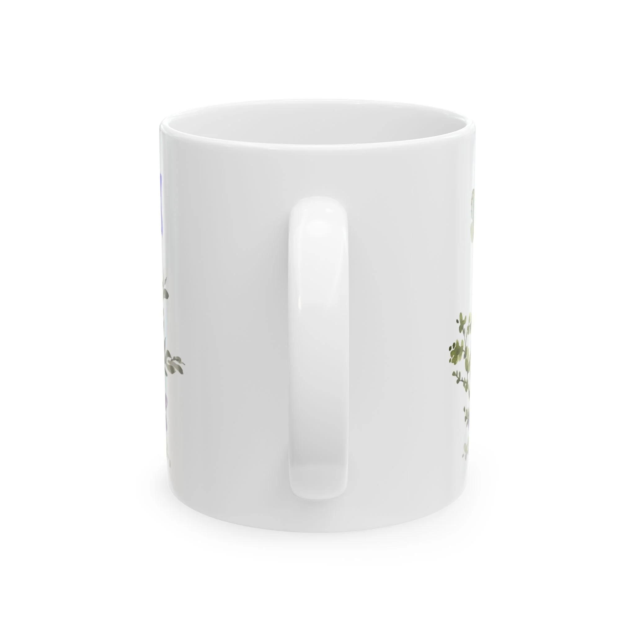 Side profile of mug showing white handle with partial floral design