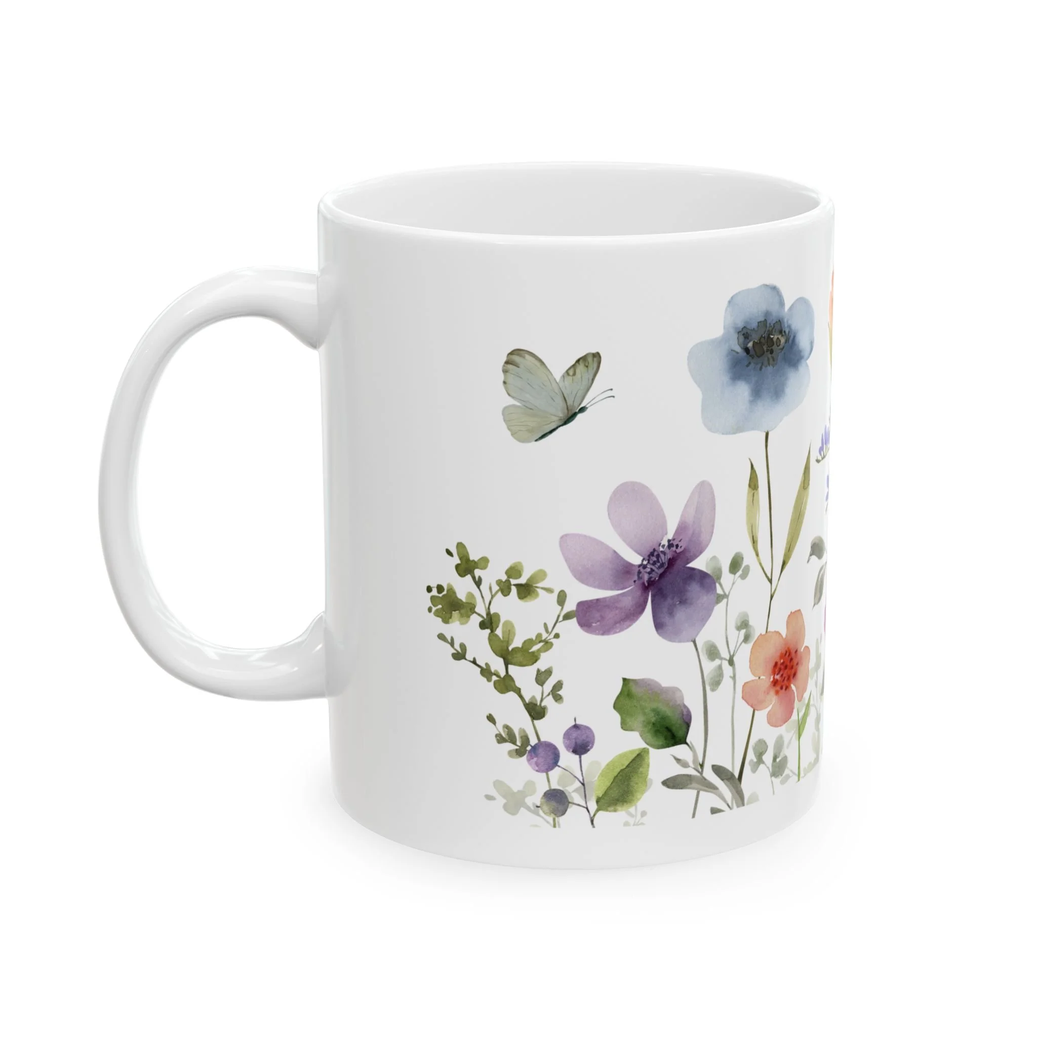 Front view of white ceramic mug with delicate mixed wildflowers wrapping around the surface