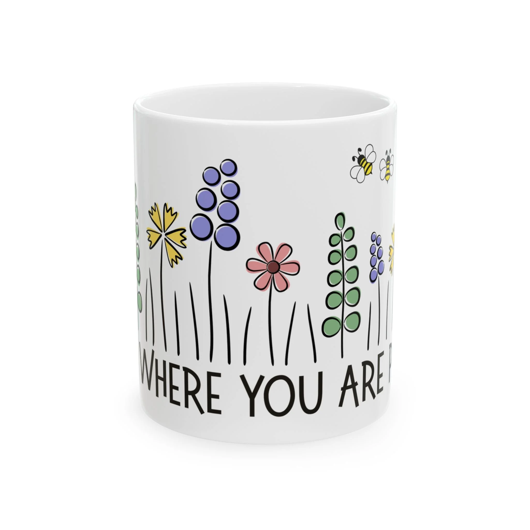 Side view of mug showing hand-drawn flowers in multiple colors