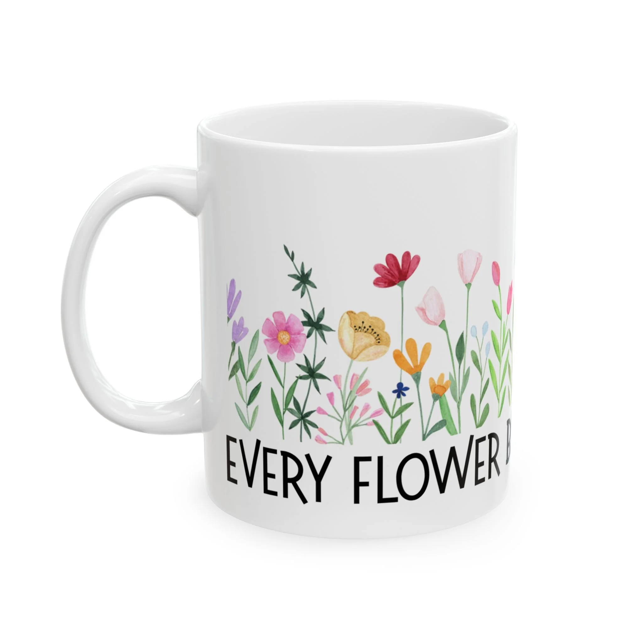 Front view of white ceramic mug with every flower blooms differently text and floral design