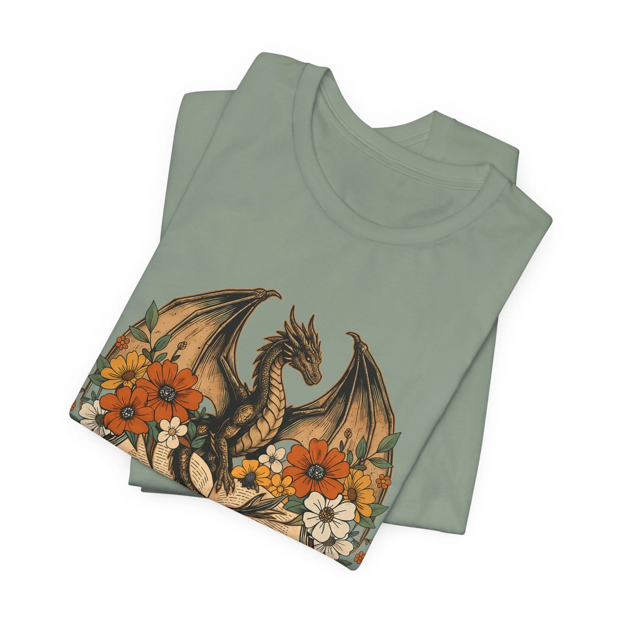 Sage green fantasy graphic tee with dragon wings and orange flowers inspired by cozy fall reading.