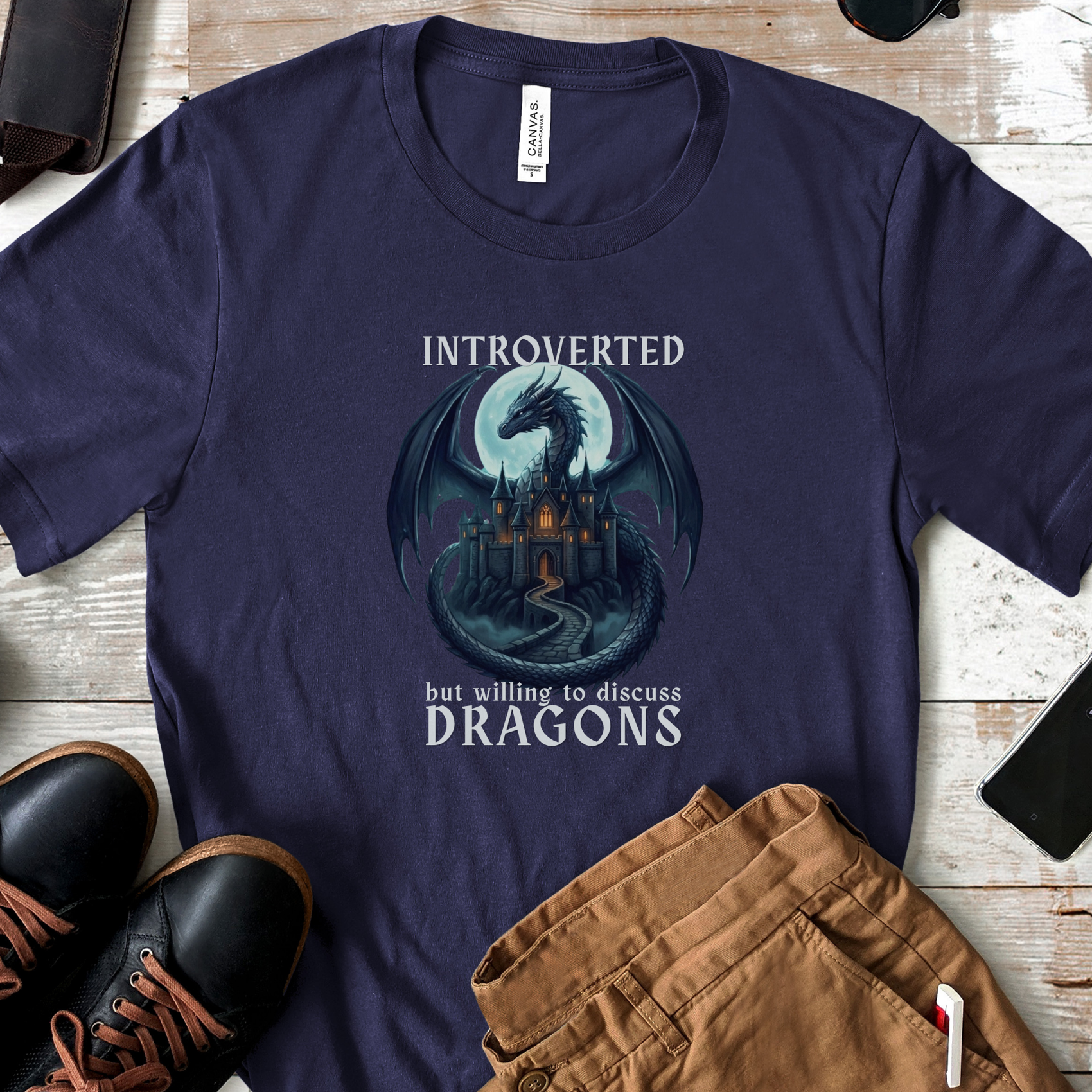 Navy fantasy t-shirt featuring a moonlit dragon and the phrase "Introverted, But Willing to Discuss Dragons."