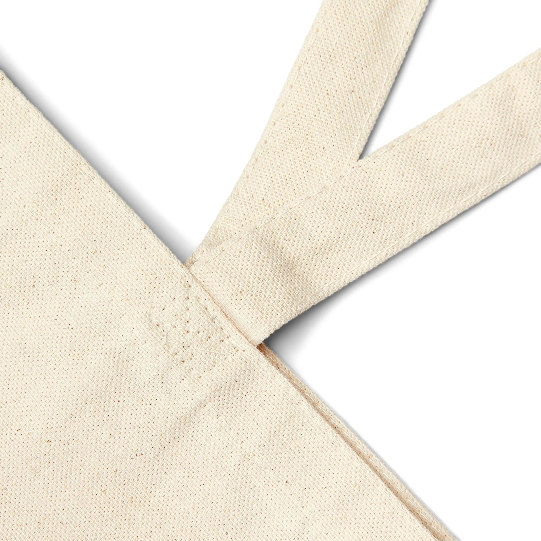 Close-up of reinforced cotton canvas tote bag handles.