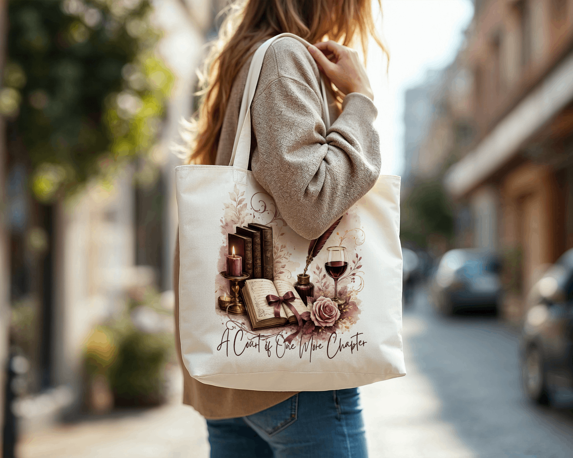 Woman carrying an A Court of Wine & Chapters canvas tote bag on a city street.