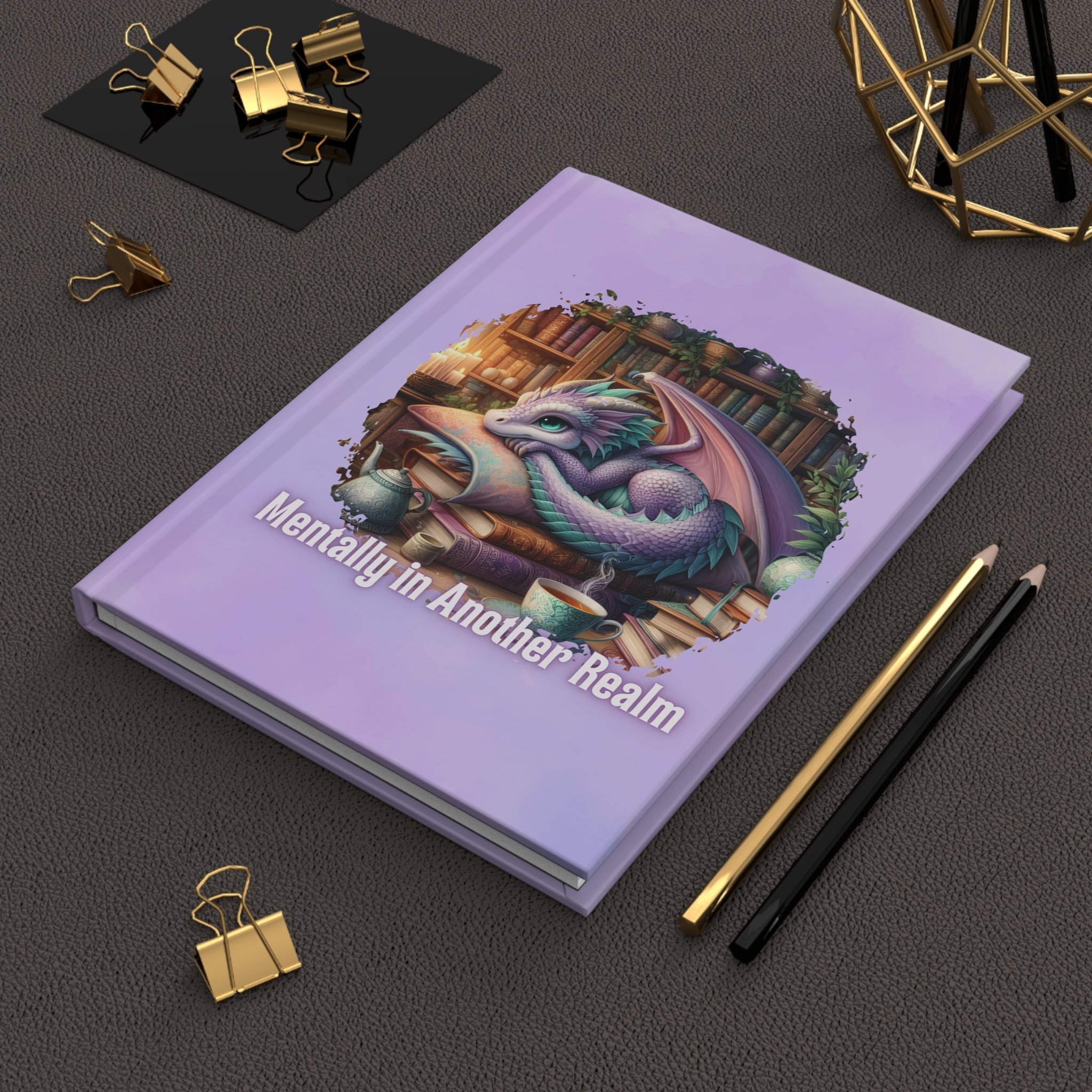 Hardcover fantasy journal with a sleeping dragon surrounded by books and the phrase "Mentally in Another Realm."