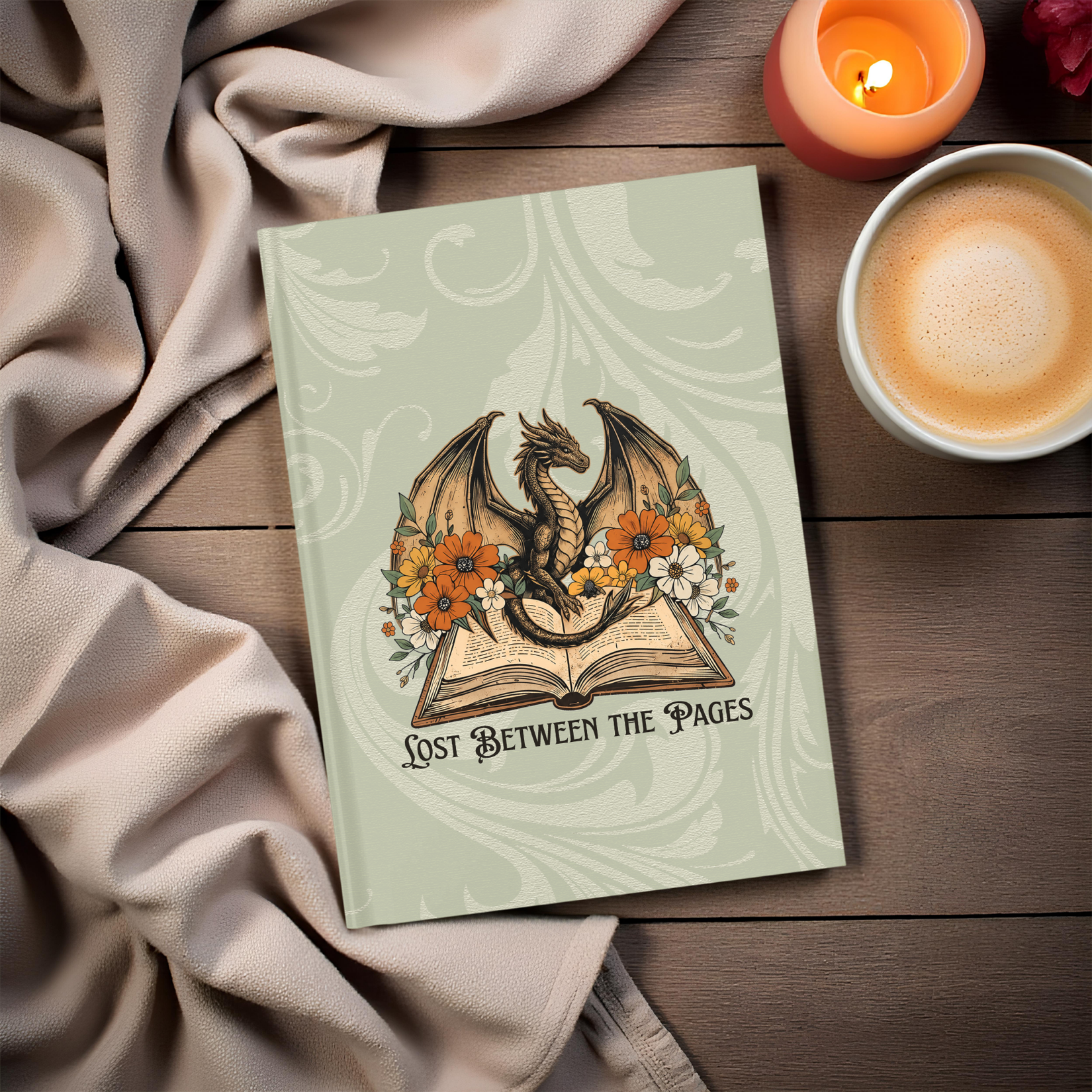 Hardcover fantasy journal featuring a dragon surrounded by autumn flowers with the phrase "Lost Between the Pages."