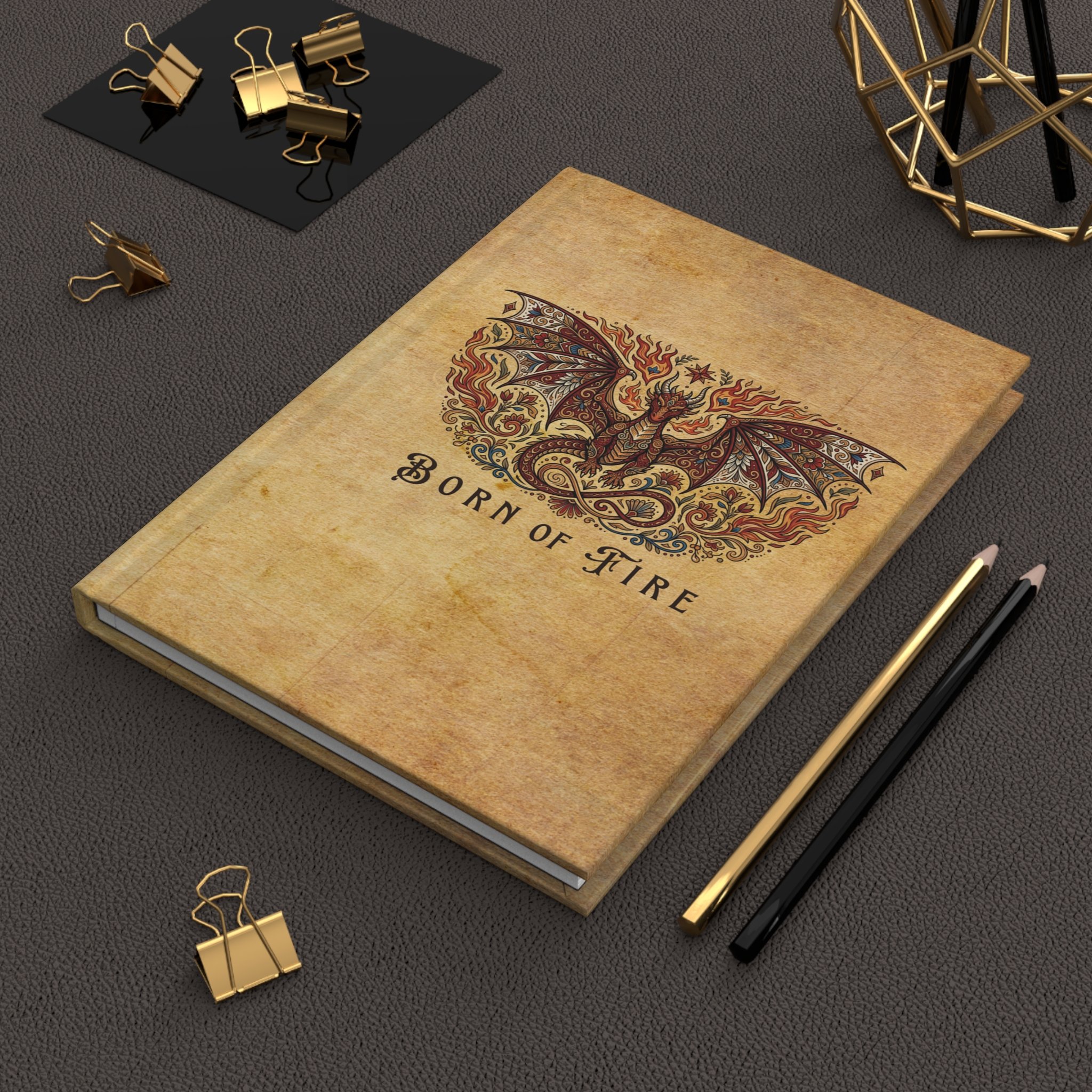 Dragon hardcover journal displayed on a desk with pencils and stationery.