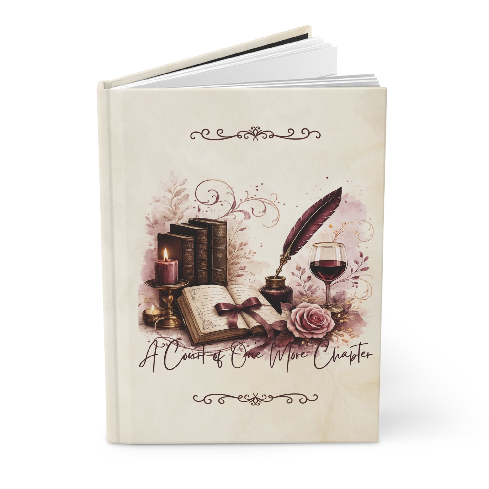Standing hardcover journal with stacked books, a feather quill, wine glass, and floral illustration.