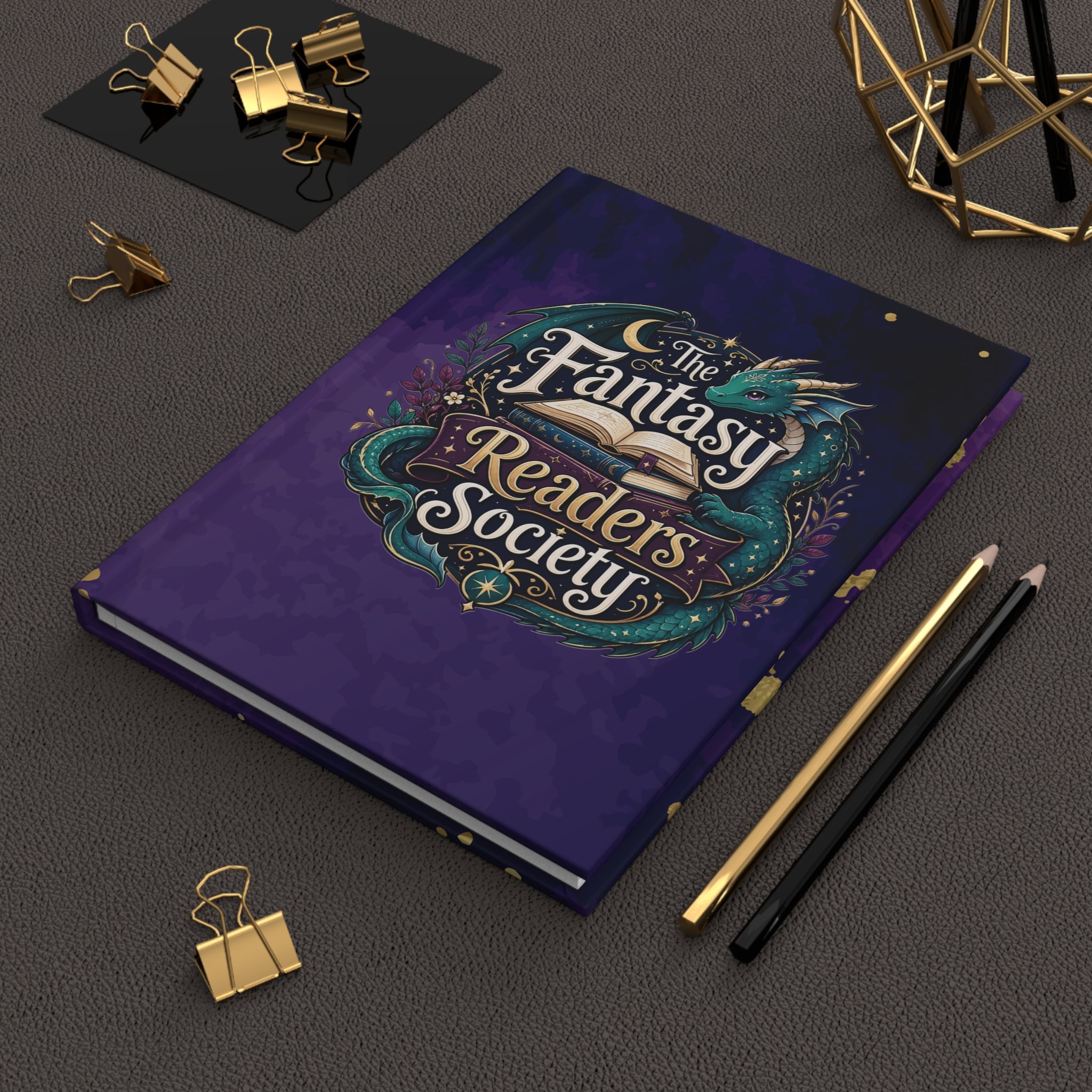 Fantasy Readers Society hardcover notebook displayed beside lavender on a wooden tabletop.