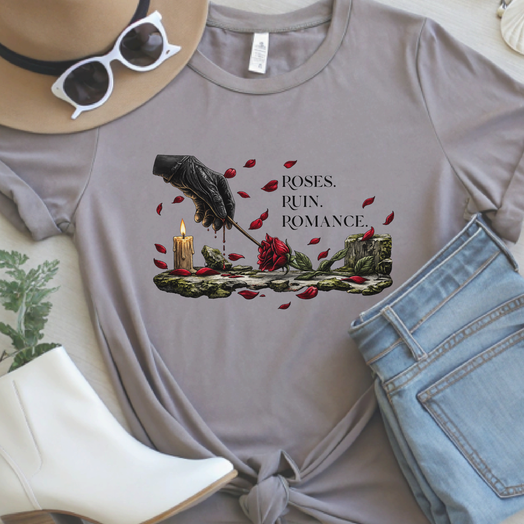 Pebble Brown Roses Ruin Romance fantasy t-shirt flat lay featuring bleeding gloved hand and red rose artwork