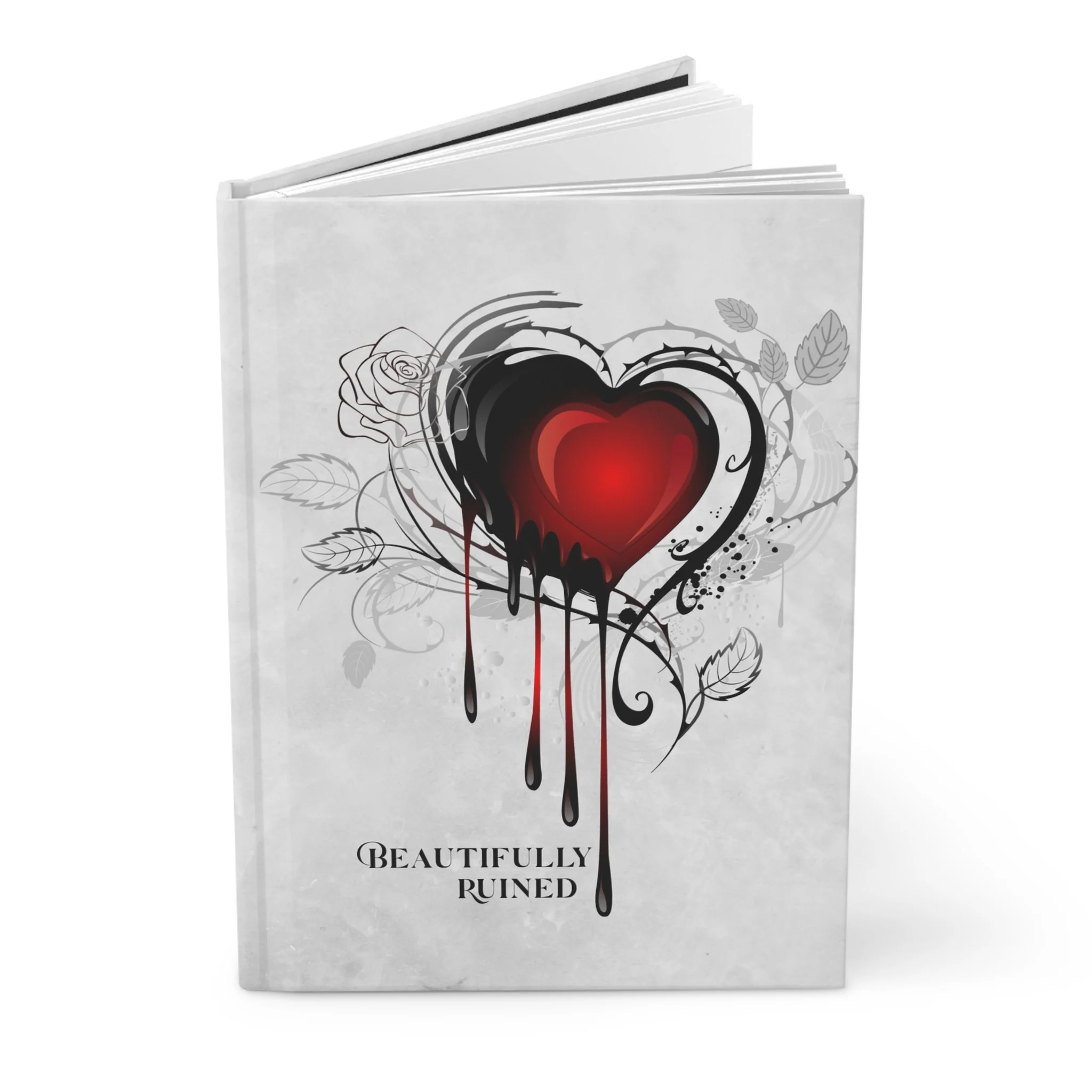 Angled view of Beautifully Ruined hardcover journal showing spine and front cover