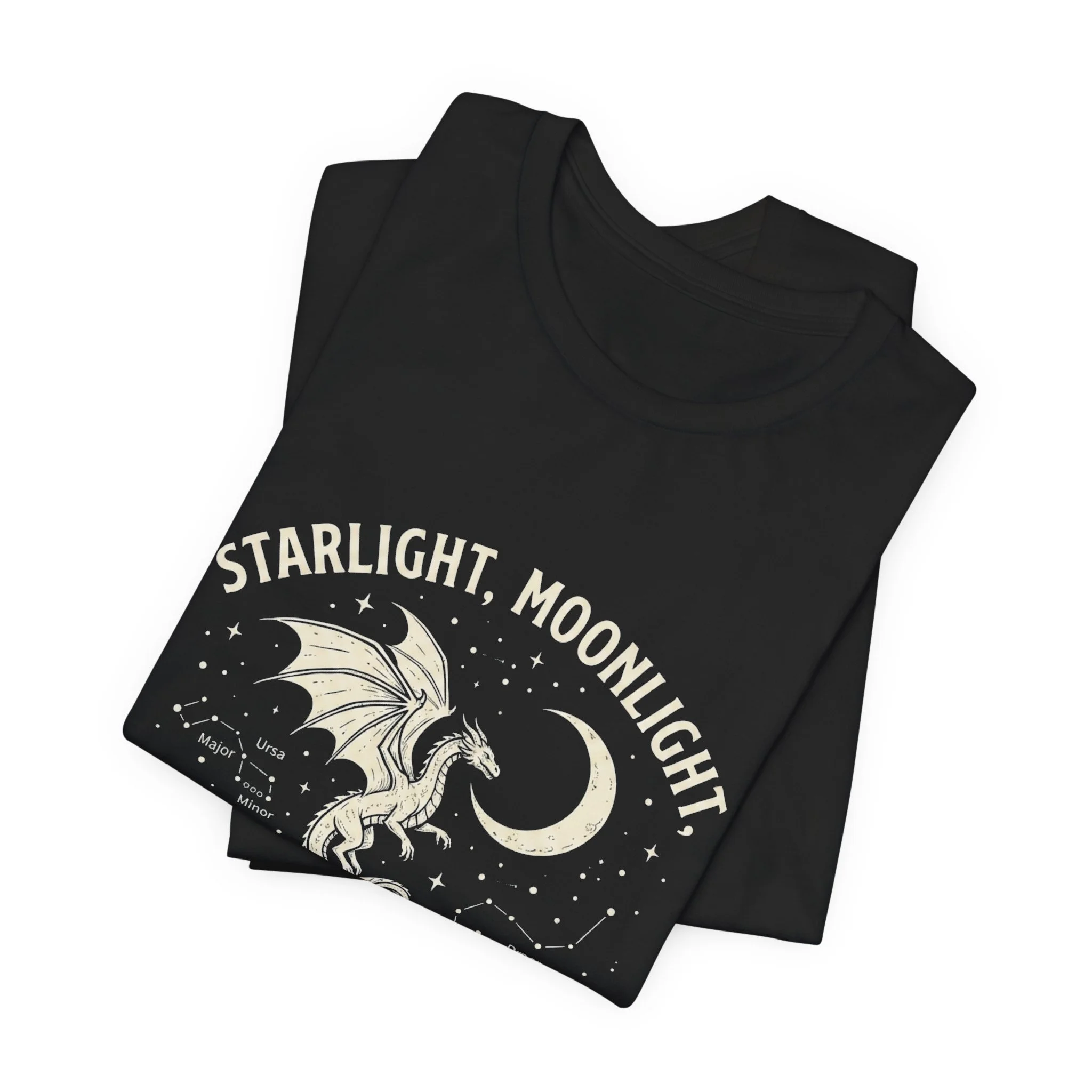 Folded Black Bella+Canvas t-shirt featuring the "Starlight, Moonlight, and Dragon Flight" dragon graphic.
