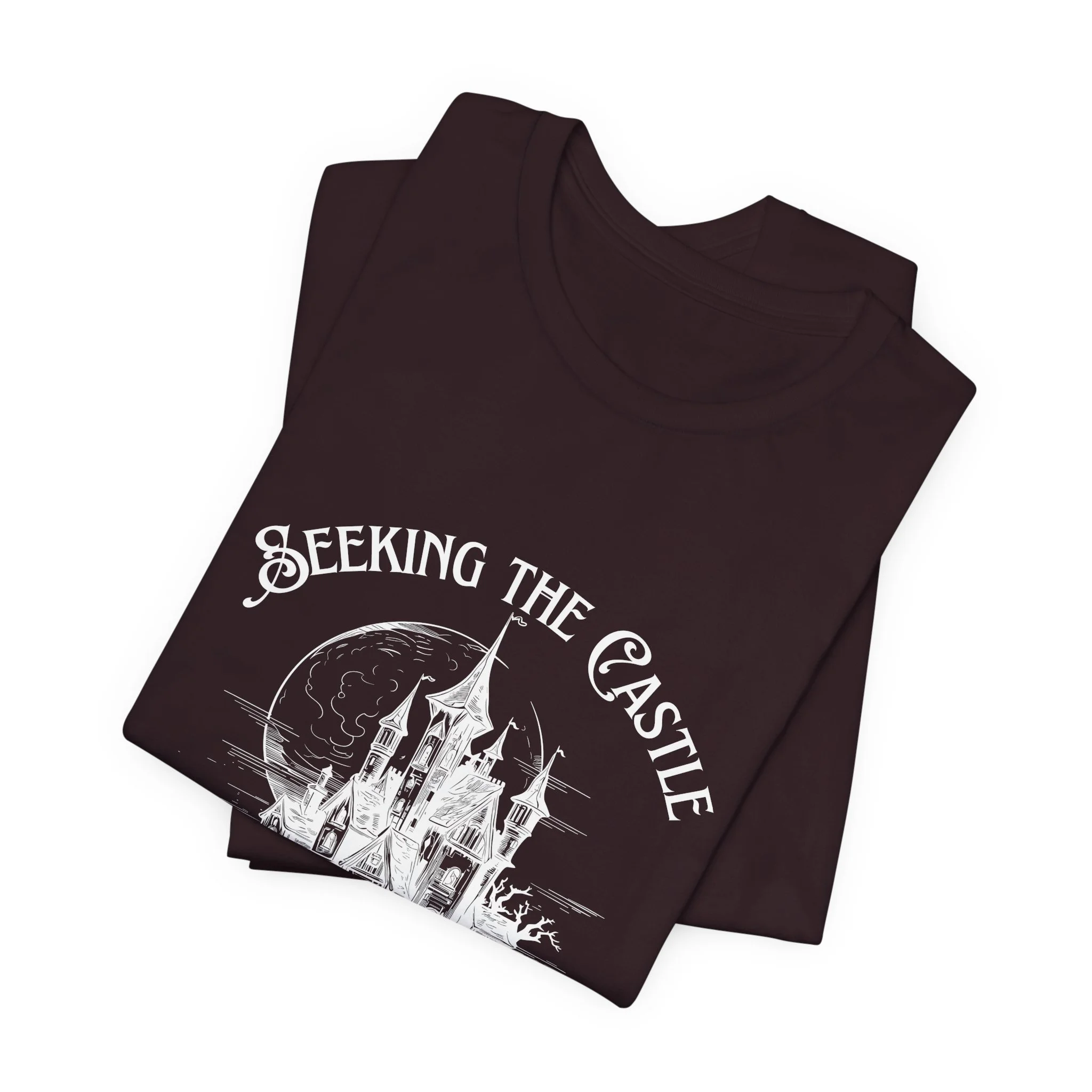 Folded Oxblood Black Bella+Canvas fantasy castle graphic t-shirt.
