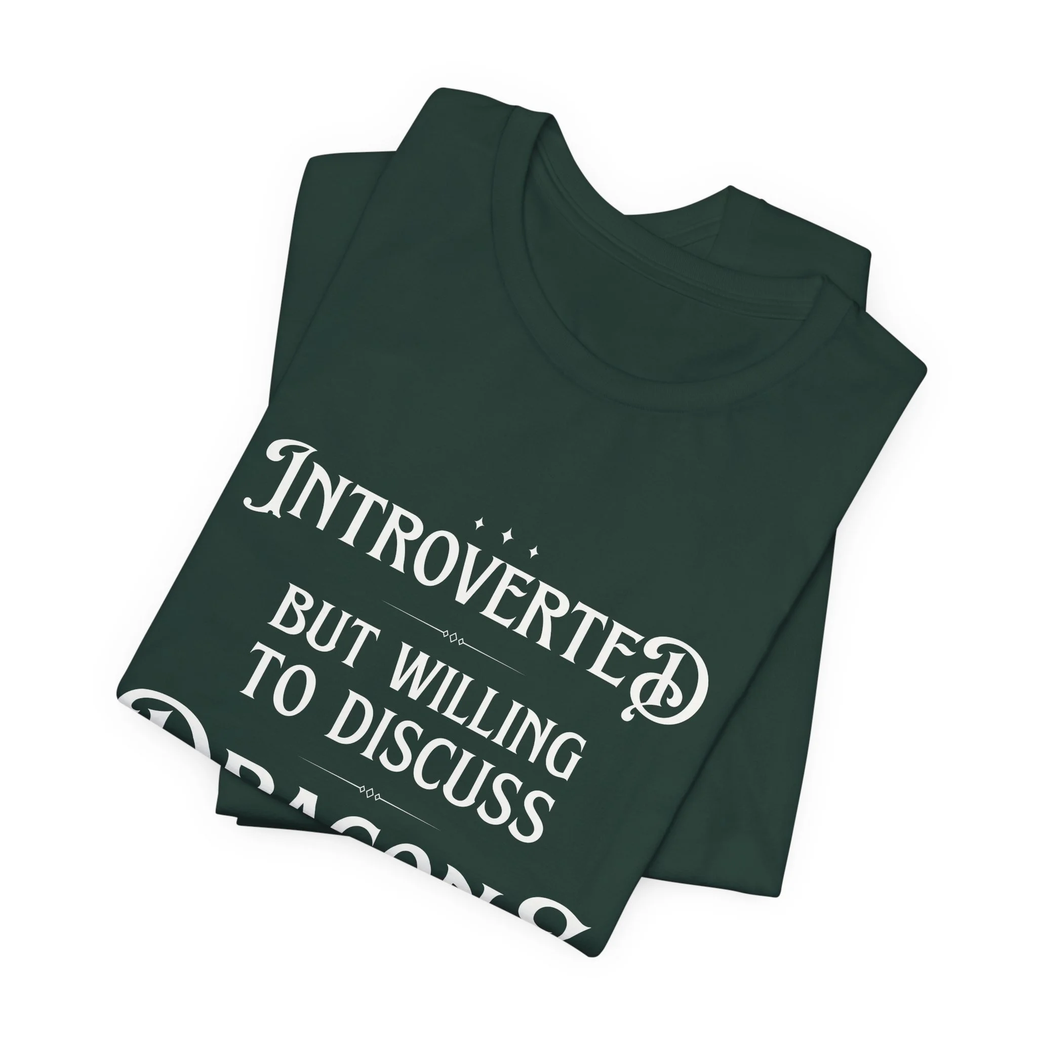Folded forest green Bella Canvas t-shirt with dragon-themed typograp