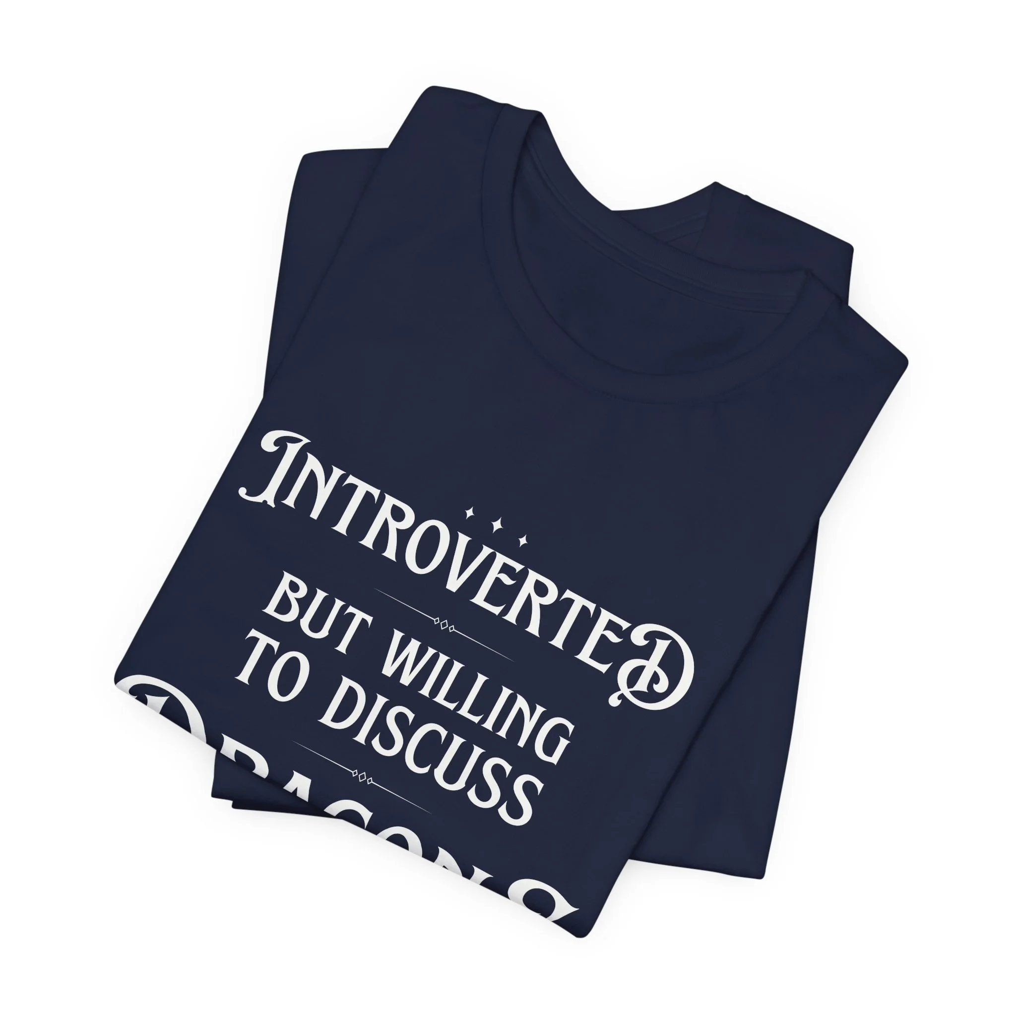 Folded Navy Bella Canvas fantasy typography graphic t-shirt.
