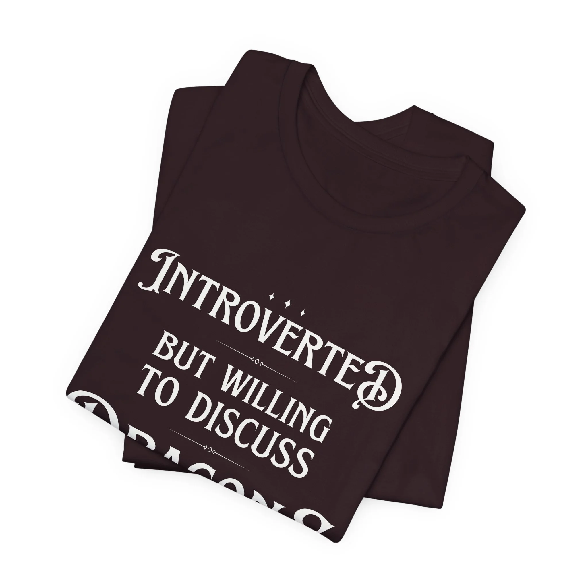 Folded oxblood Bella Canvas t-shirt with dragon-themed typograp