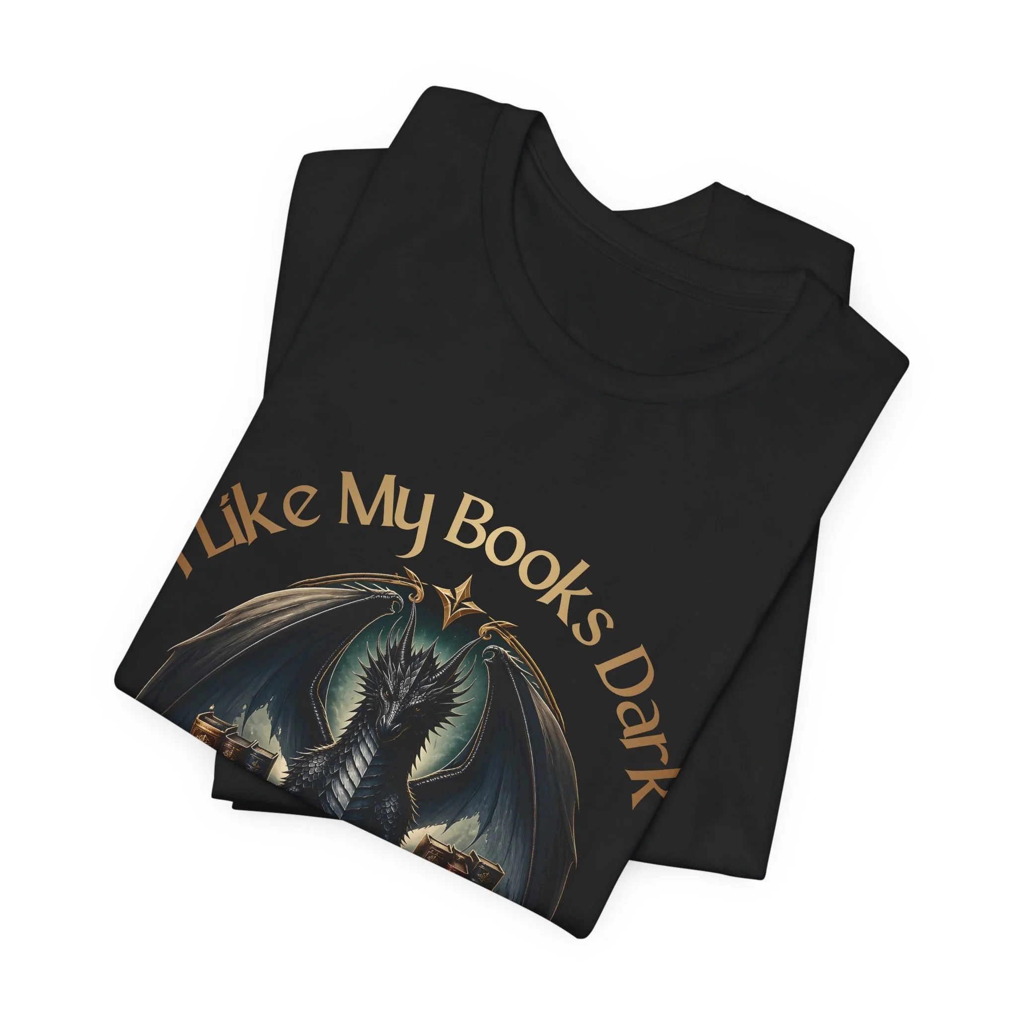 Folded black dragon book lover shirt with bronze lettering and detailed fantasy artwork.