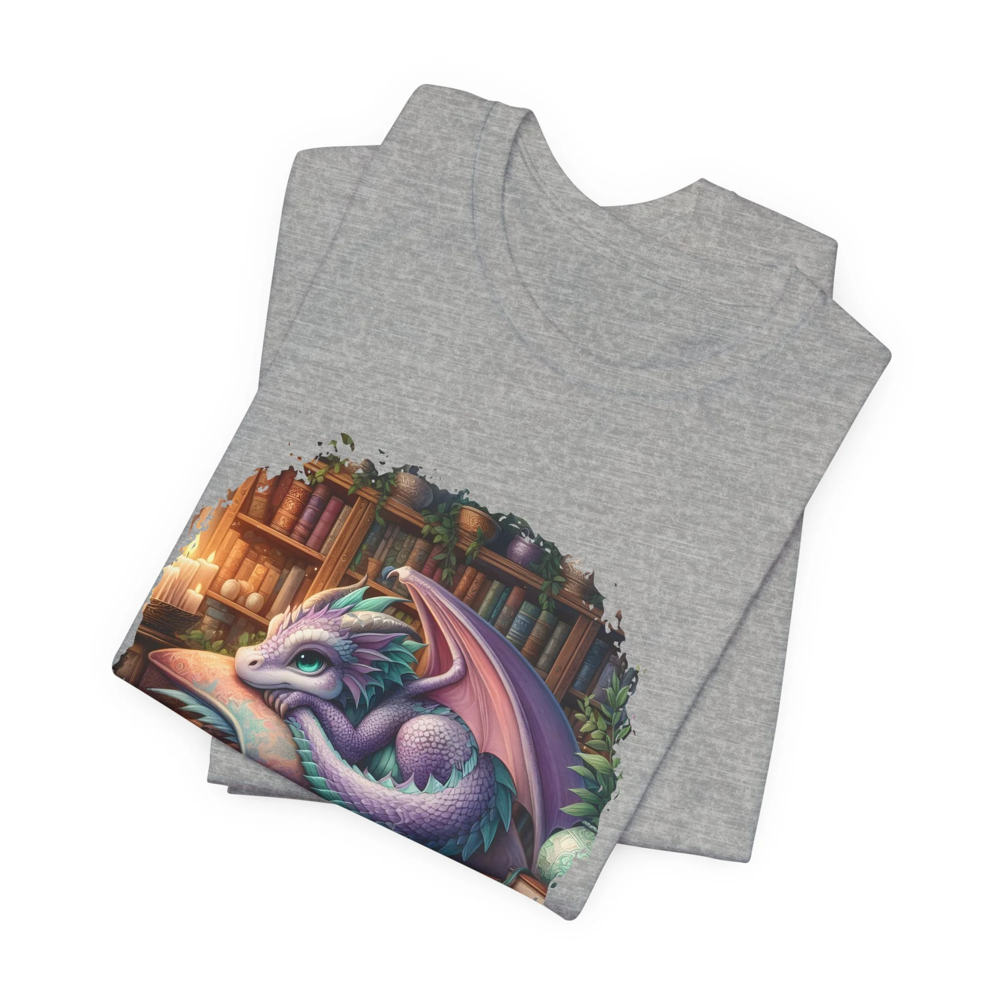 Heather gray dragon graphic tee with cozy library scene and pastel fantasy illustration.