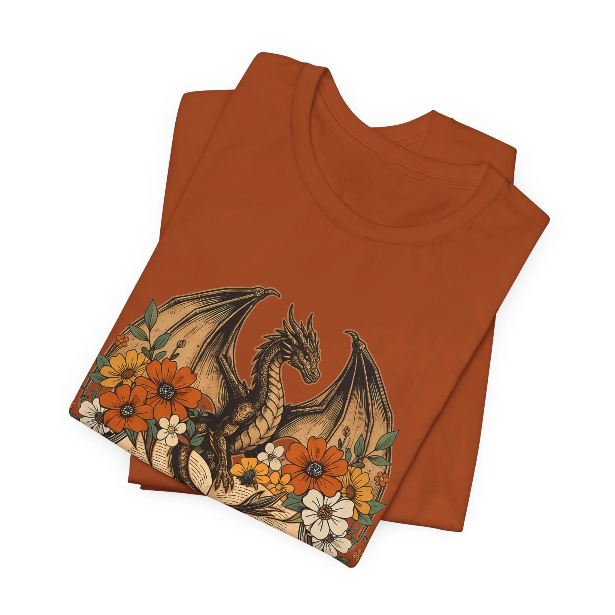 Folded terracotta dragon book lover shirt with autumn floral artwork and open book design.