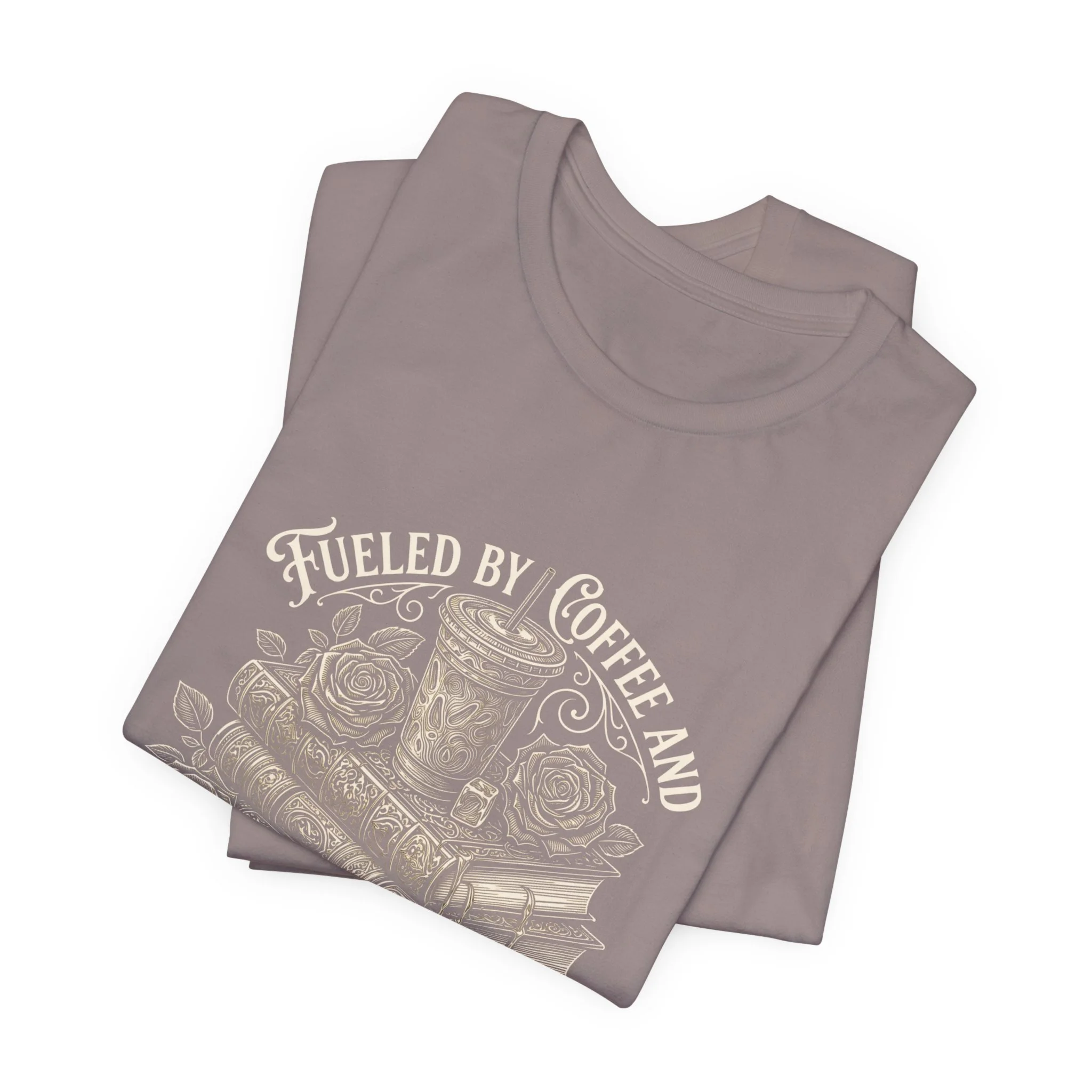 Folded Pebble Brown Bella+Canvas t-shirt featuring the "Fueled by Coffee and Smutty Tales" design.