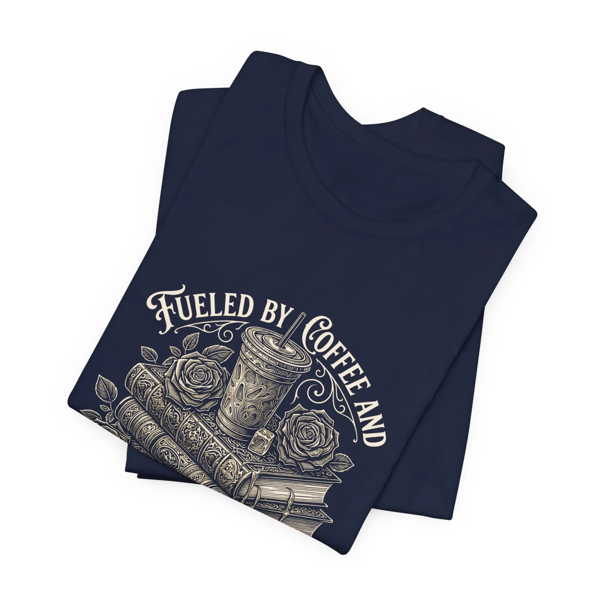 Folded Navy Bella+Canvas t-shirt with coffee and stacked books illustration.