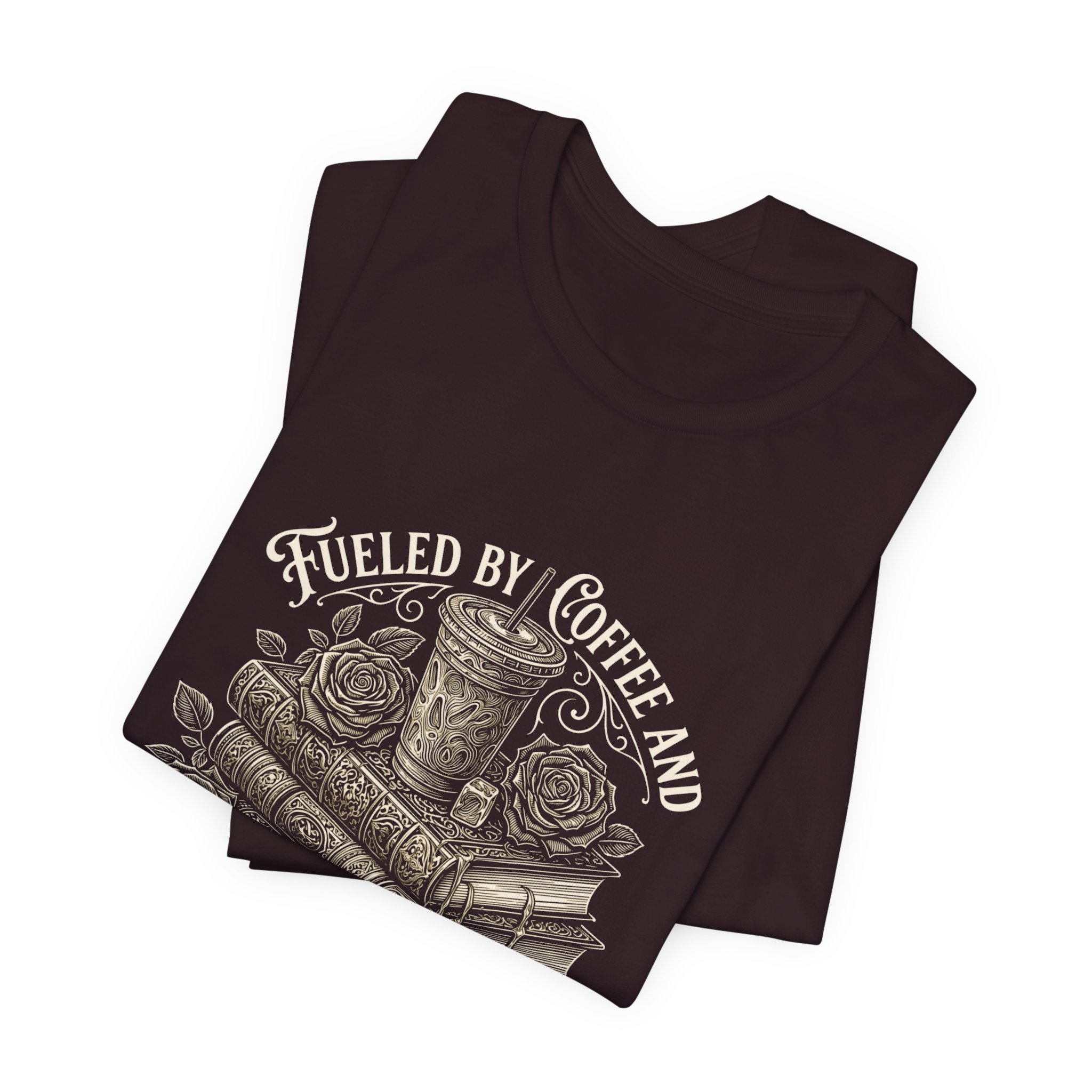 Folded Oxblood Black Bella+Canvas t-shirt with vintage coffee and book artwork.