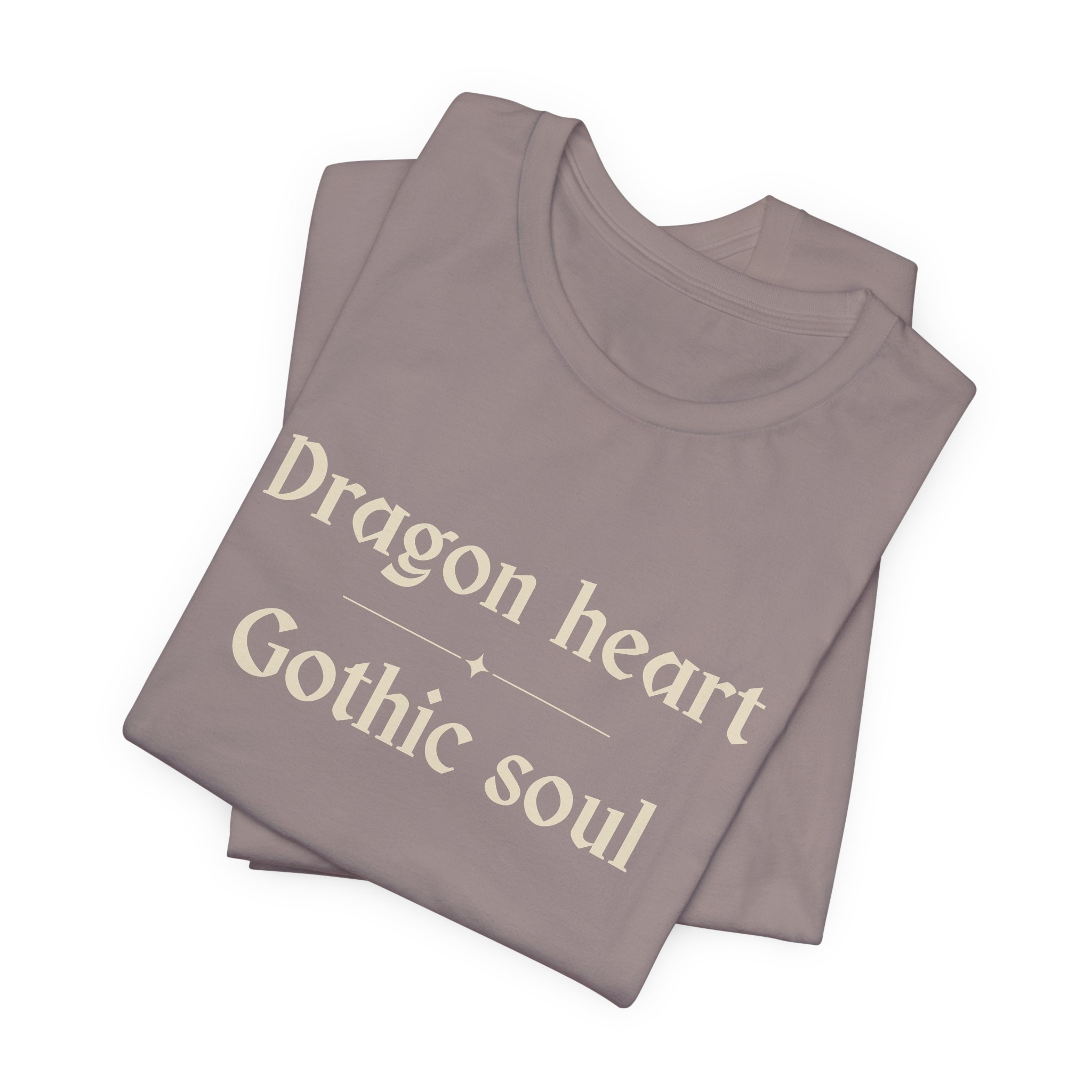 Folded Pebble Brown Bella+Canvas t-shirt featuring the "Dragon Heart, Gothic Soul" typography design.