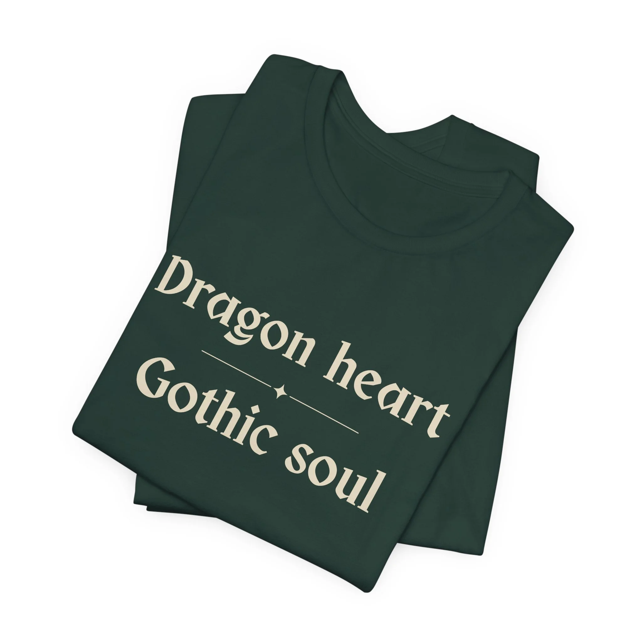 Folded Forest Green Bella+Canvas "Dragon Heart, Gothic Soul" graphic t-shirt.
