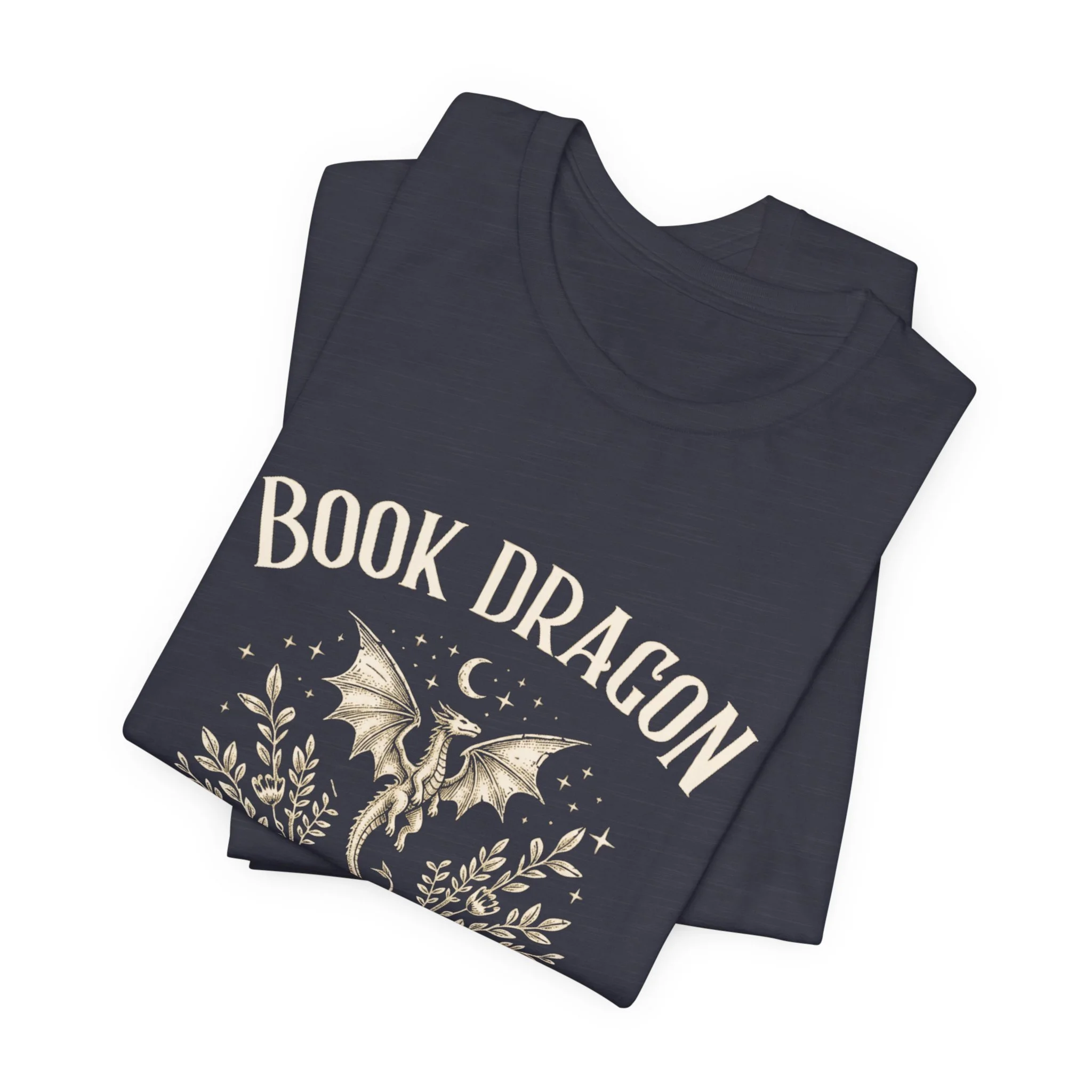 Folded Heather Midnight Navy Bella+Canvas fantasy book lover t-shirt with dragon artwork.
