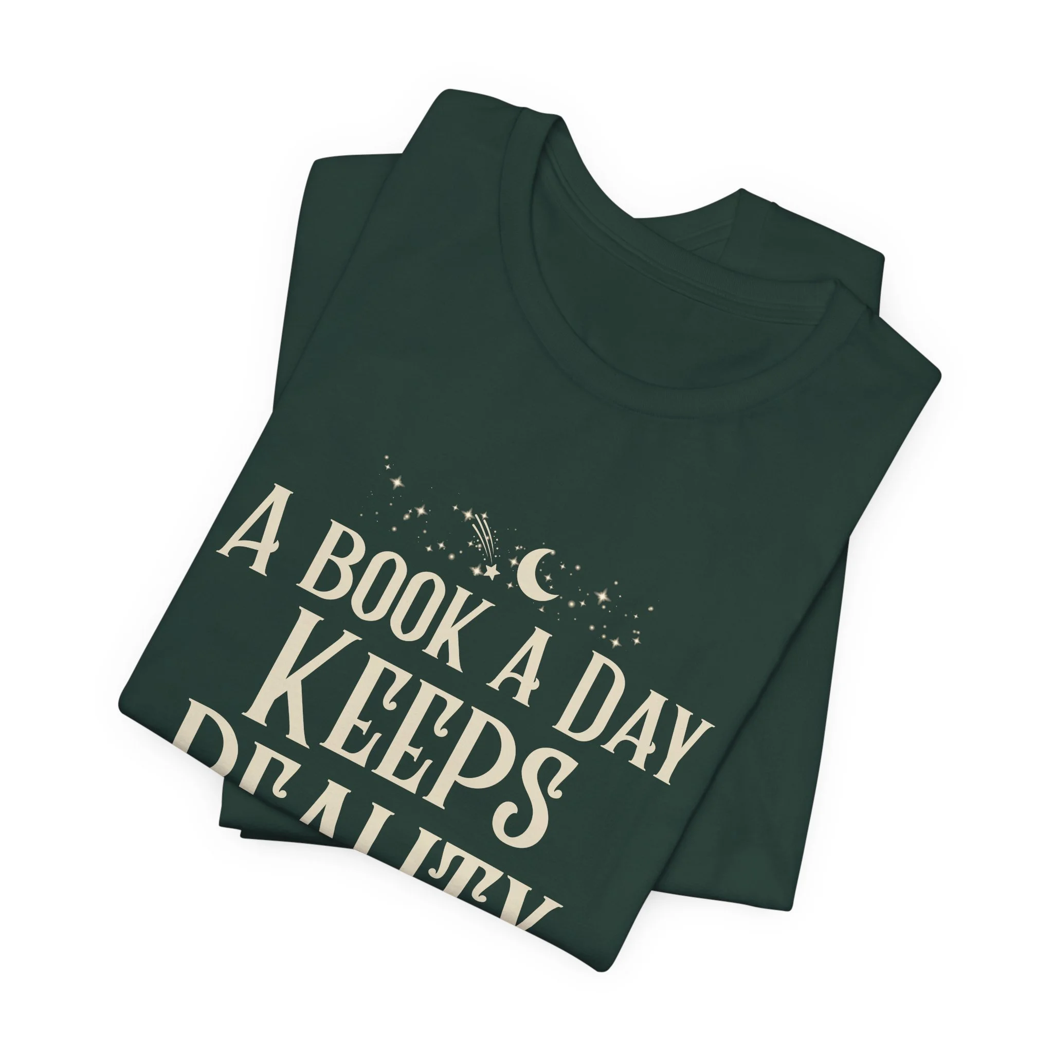 Folded Forest Green Bella+Canvas book lover t-shirt with celestial typography.