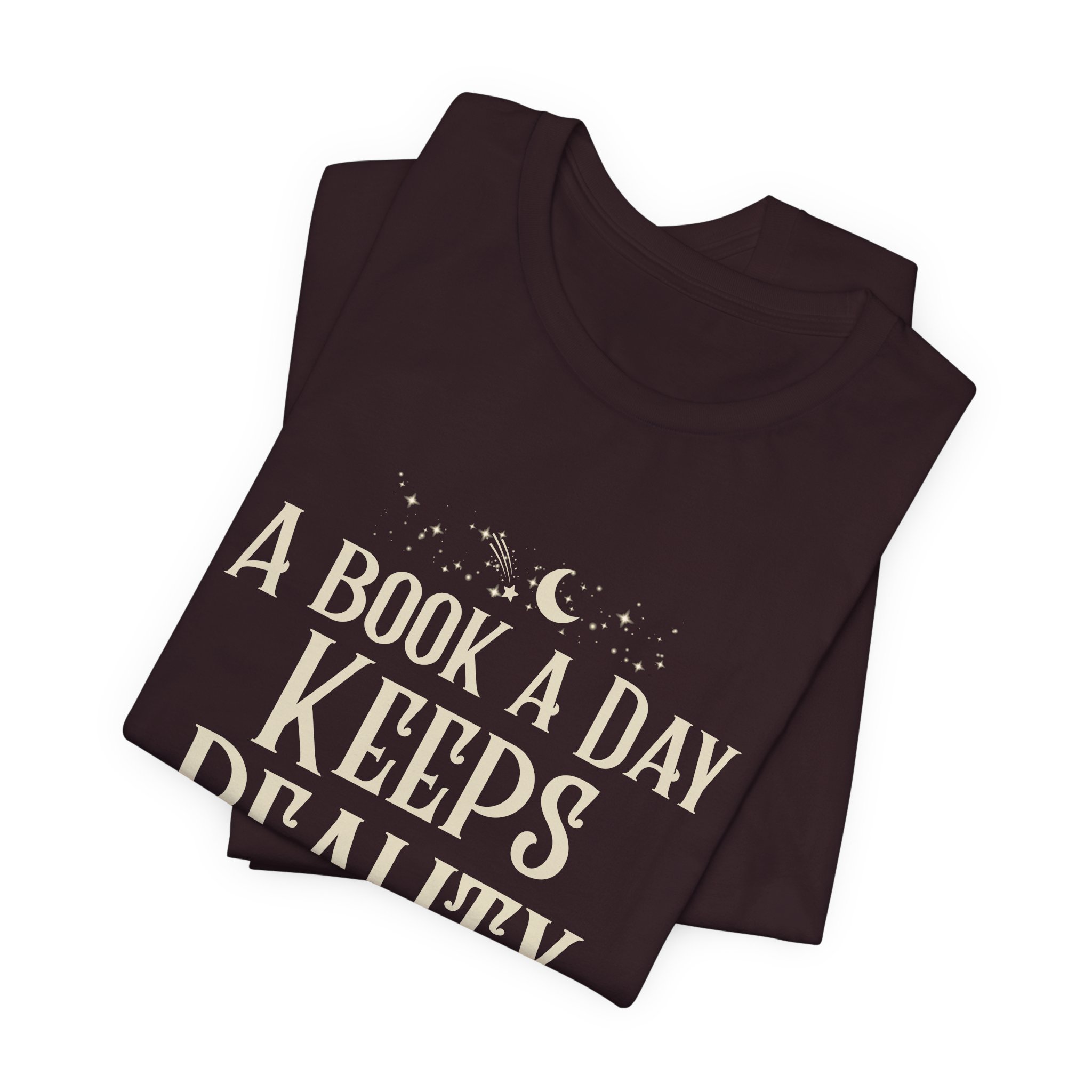 Folded Oxblood Black Bella+Canvas book lover graphic t-shirt with moon and stars.