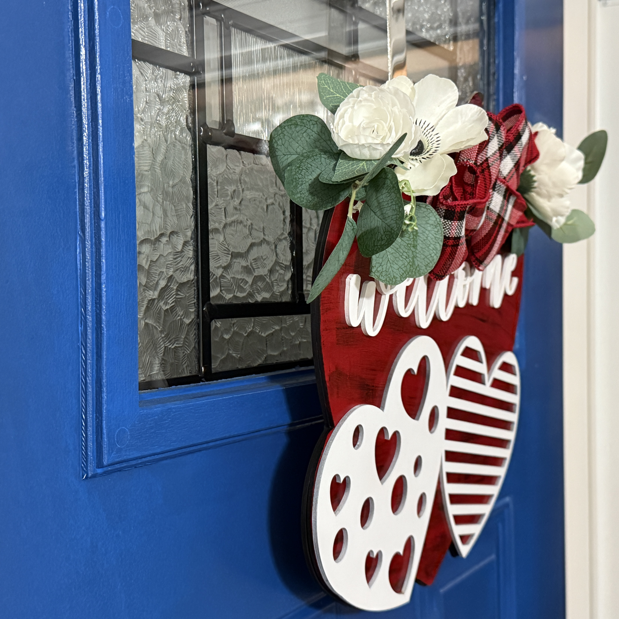 Valentine's Day door hanger, side view, showing base thickness and layered wood details