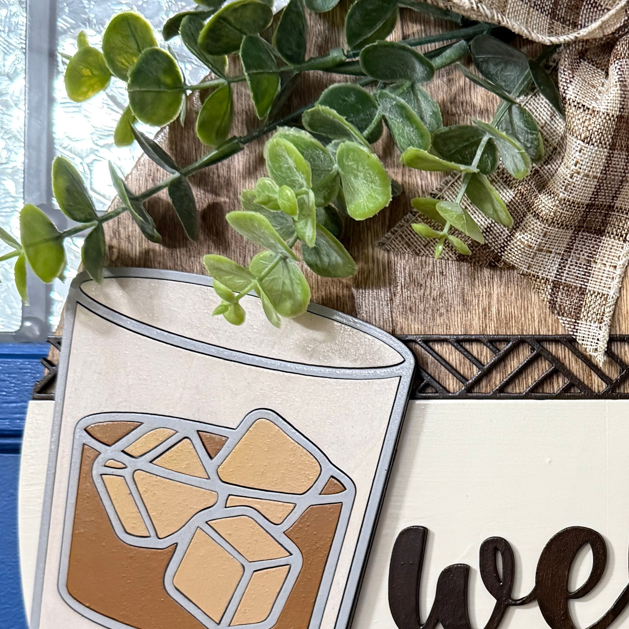 Close-up of whiskey glass with ice cubes and amber liquid detail