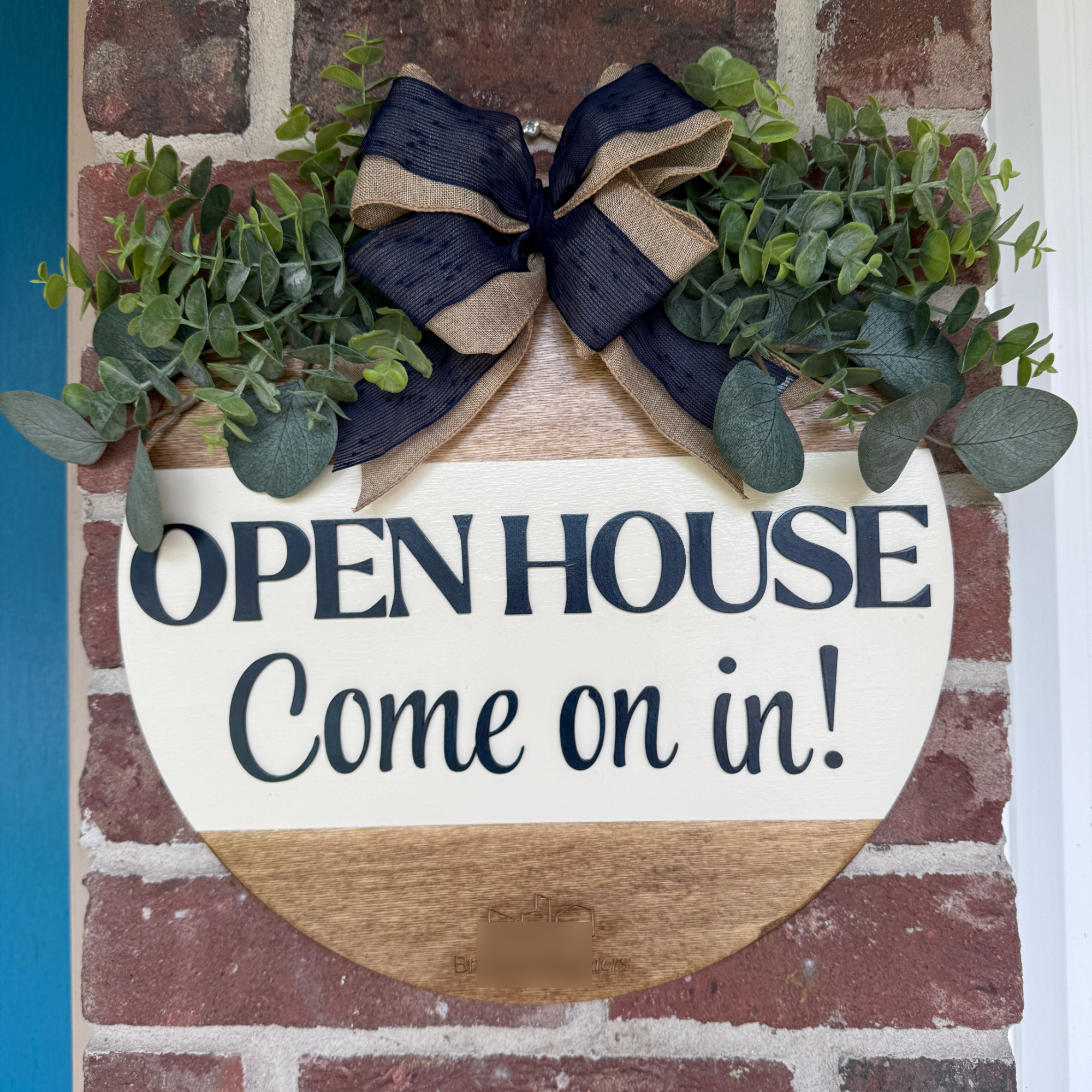 Custom open house welcome sign for real estate agents displayed on a front door.