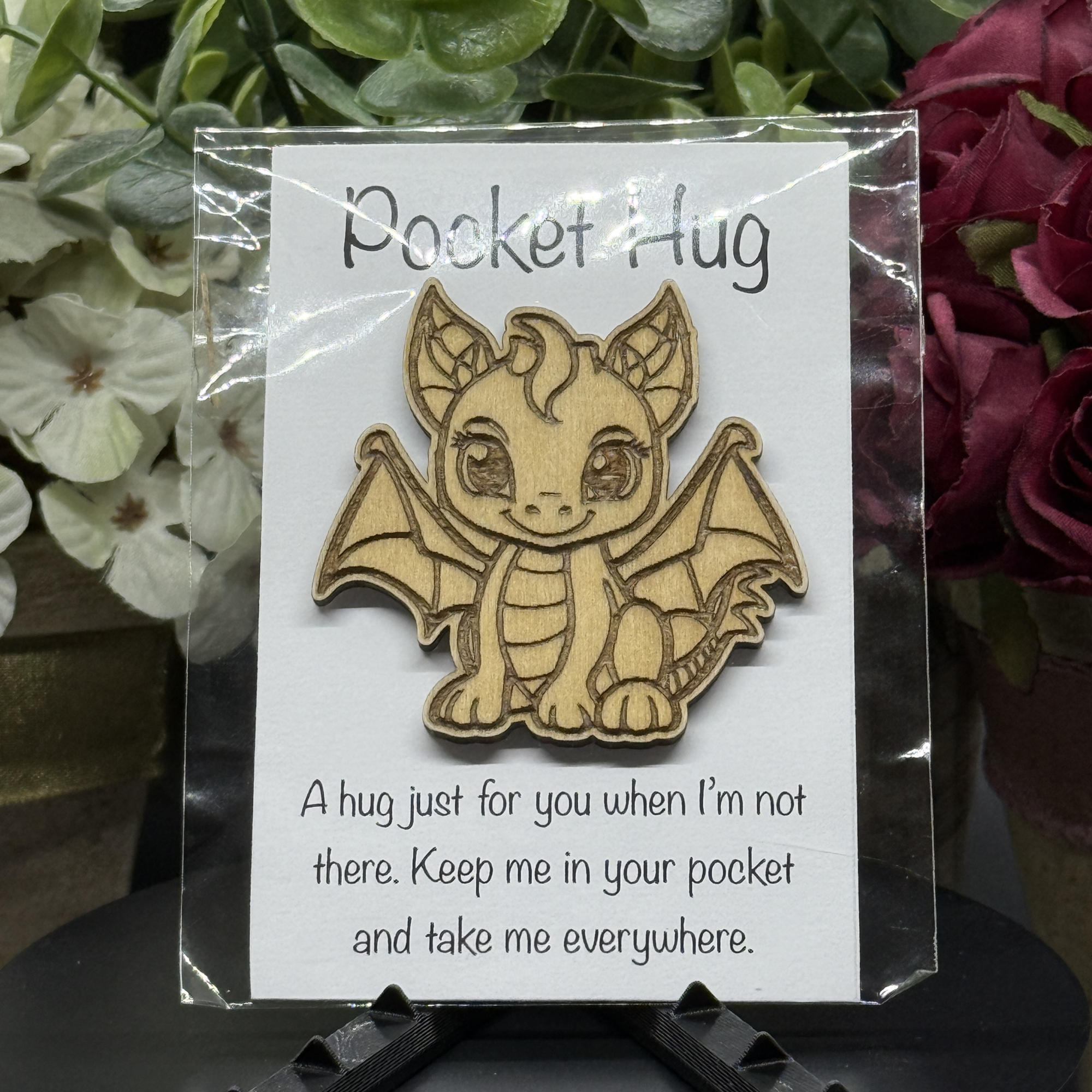 Sweet Dragon Pocket Hug token on printed card – sitting dragon with gentle eyes and floral background