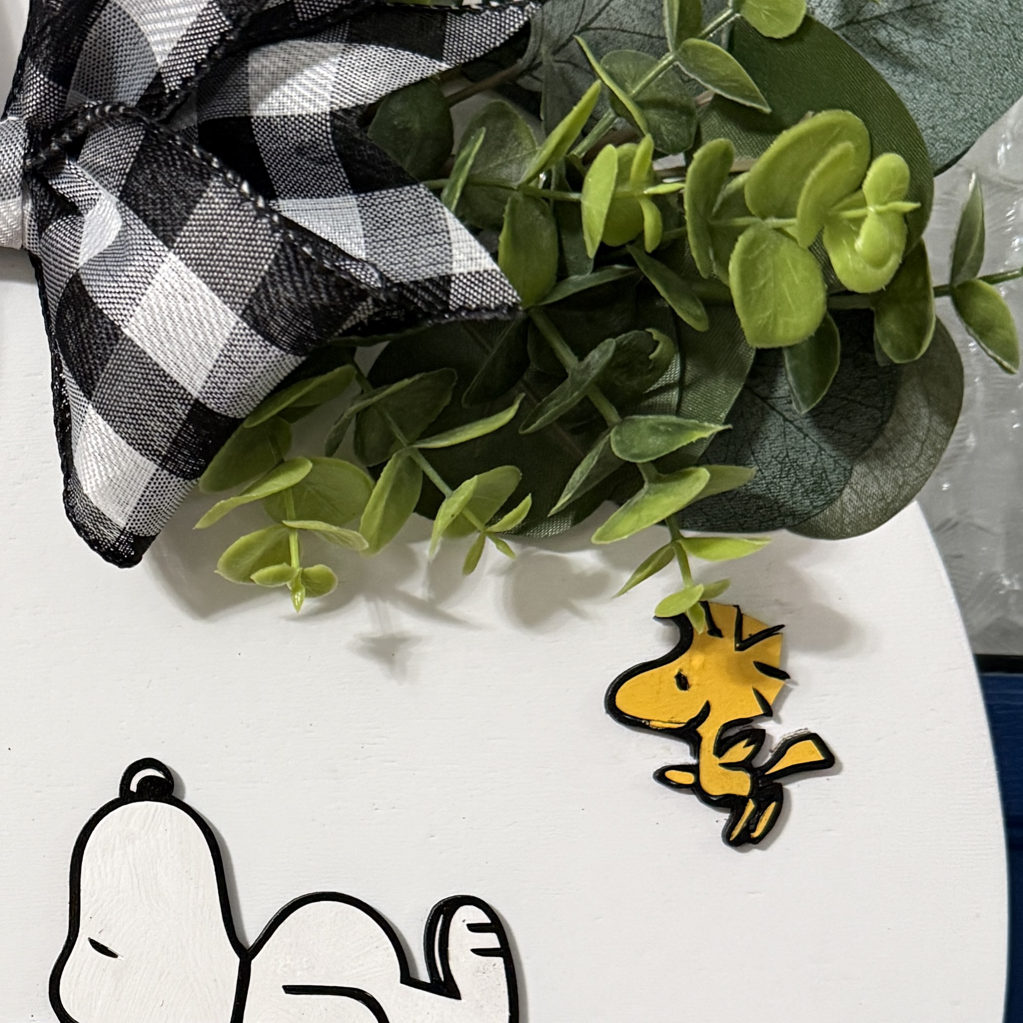 Close-up of “Happy Spring” text in raised yellow lettering on white background