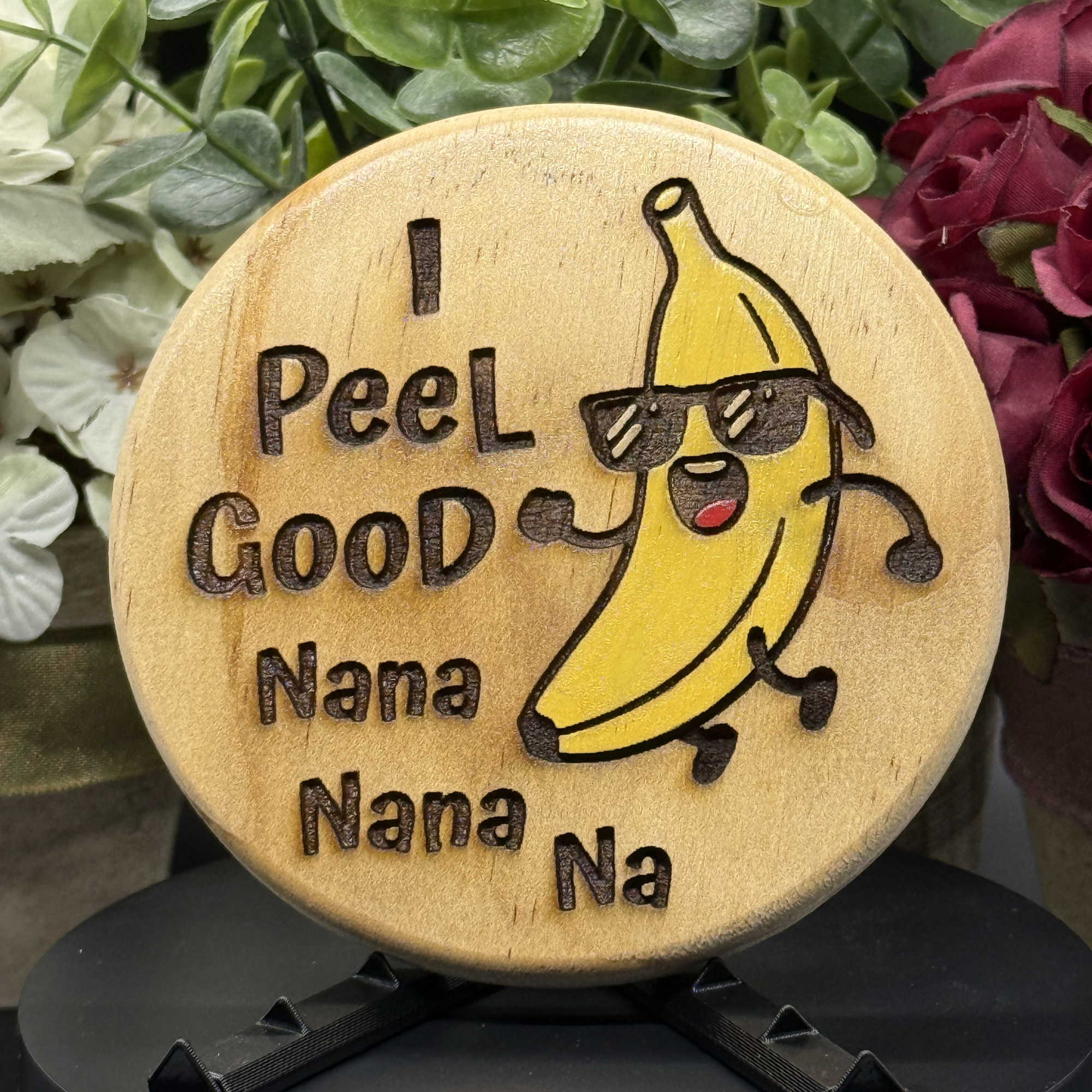 Round pine wood coaster with dancing banana character, sunglasses, and the phrase ‘I Peel Good Nana Nana Nana Na,’ laser-engraved and hand-painted